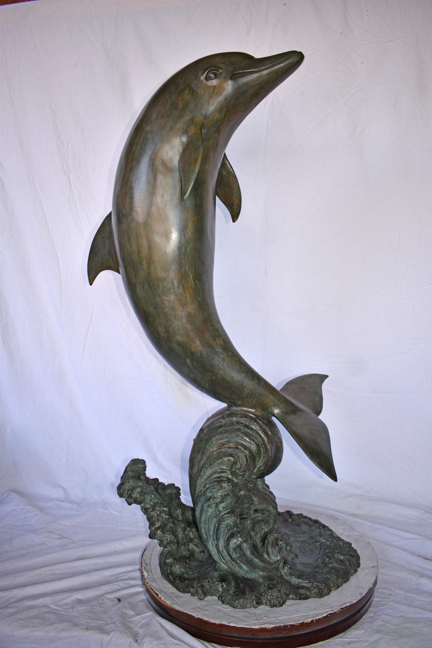 Fountain of A Dolphin Jumping of The Water Made of Bronze Size: 21"x 30" x 50"H.