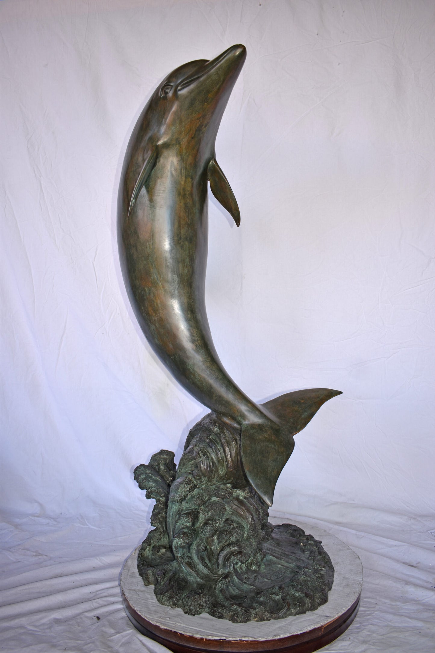 Fountain of A Dolphin Jumping of The Water Made of Bronze Size: 21"x 30" x 50"H.