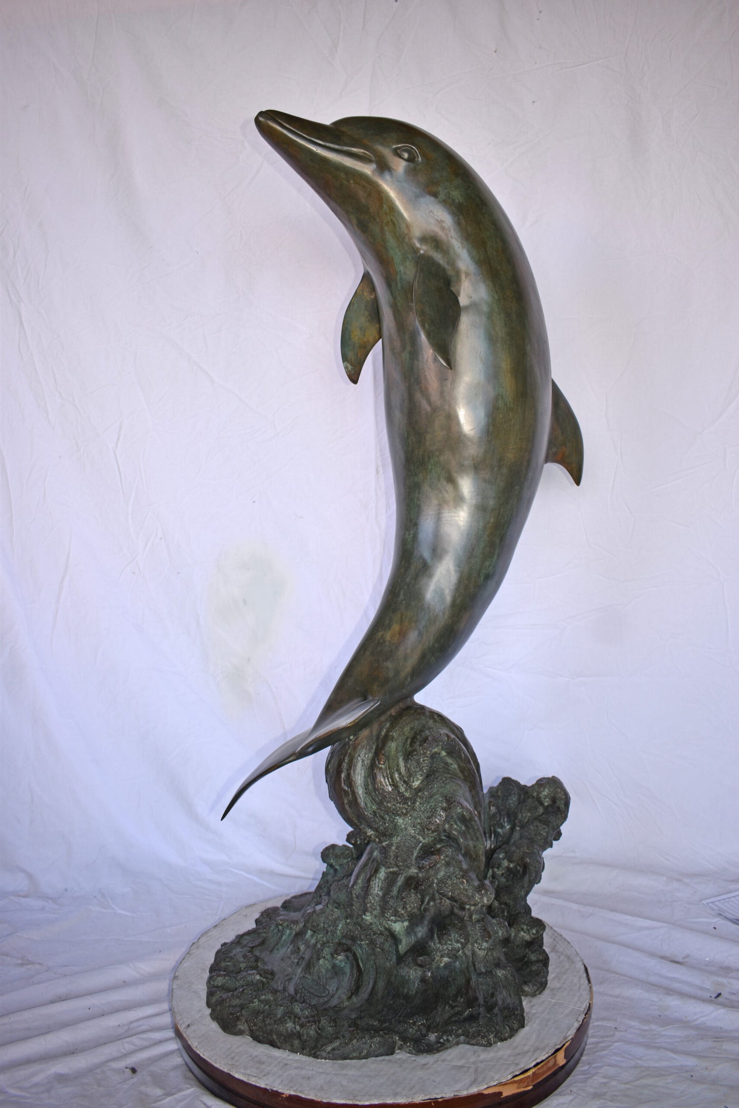 Fountain of A Dolphin Jumping of The Water Made of Bronze Size: 21"x 30" x 50"H.