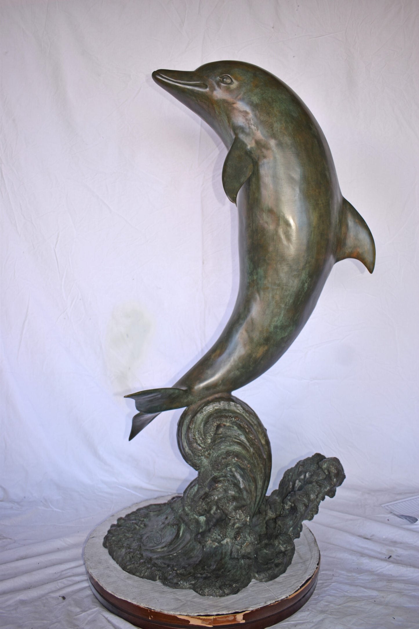 Fountain of A Dolphin Jumping of The Water Made of Bronze Size: 21"x 30" x 50"H.
