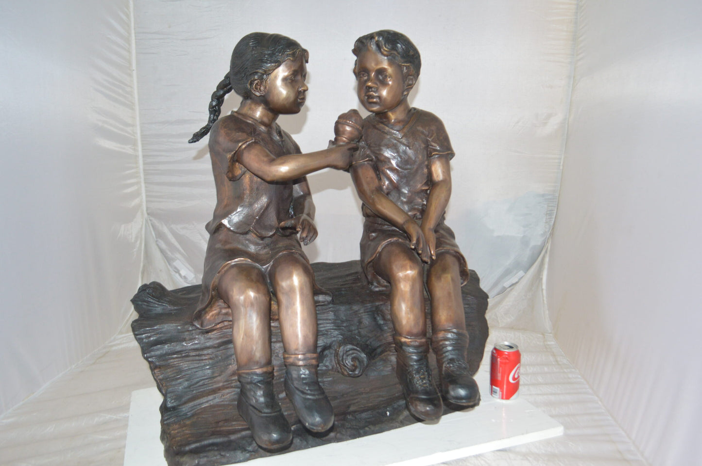 Boy and Girl enjoying an ice-cream bronze statue -  Size: 28"L x 24"W x 33"H.