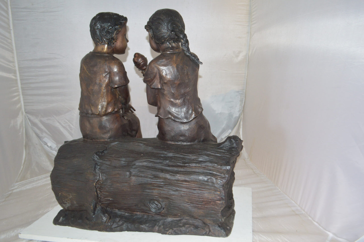 Boy and Girl enjoying an ice-cream bronze statue -  Size: 28"L x 24"W x 33"H.