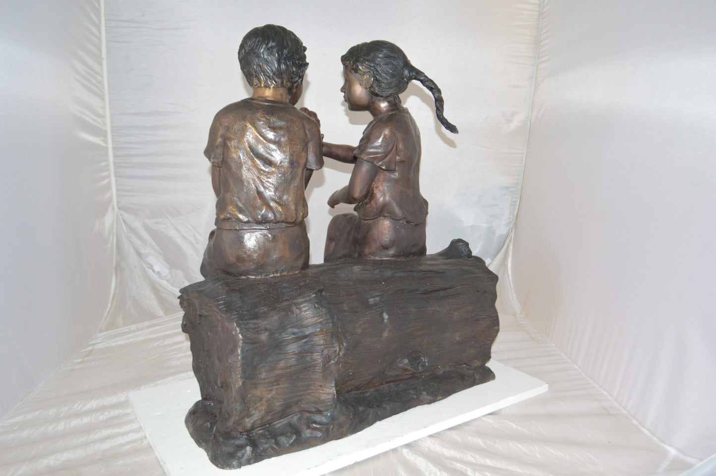 Boy and Girl enjoying an ice-cream bronze statue -  Size: 28"L x 24"W x 33"H.