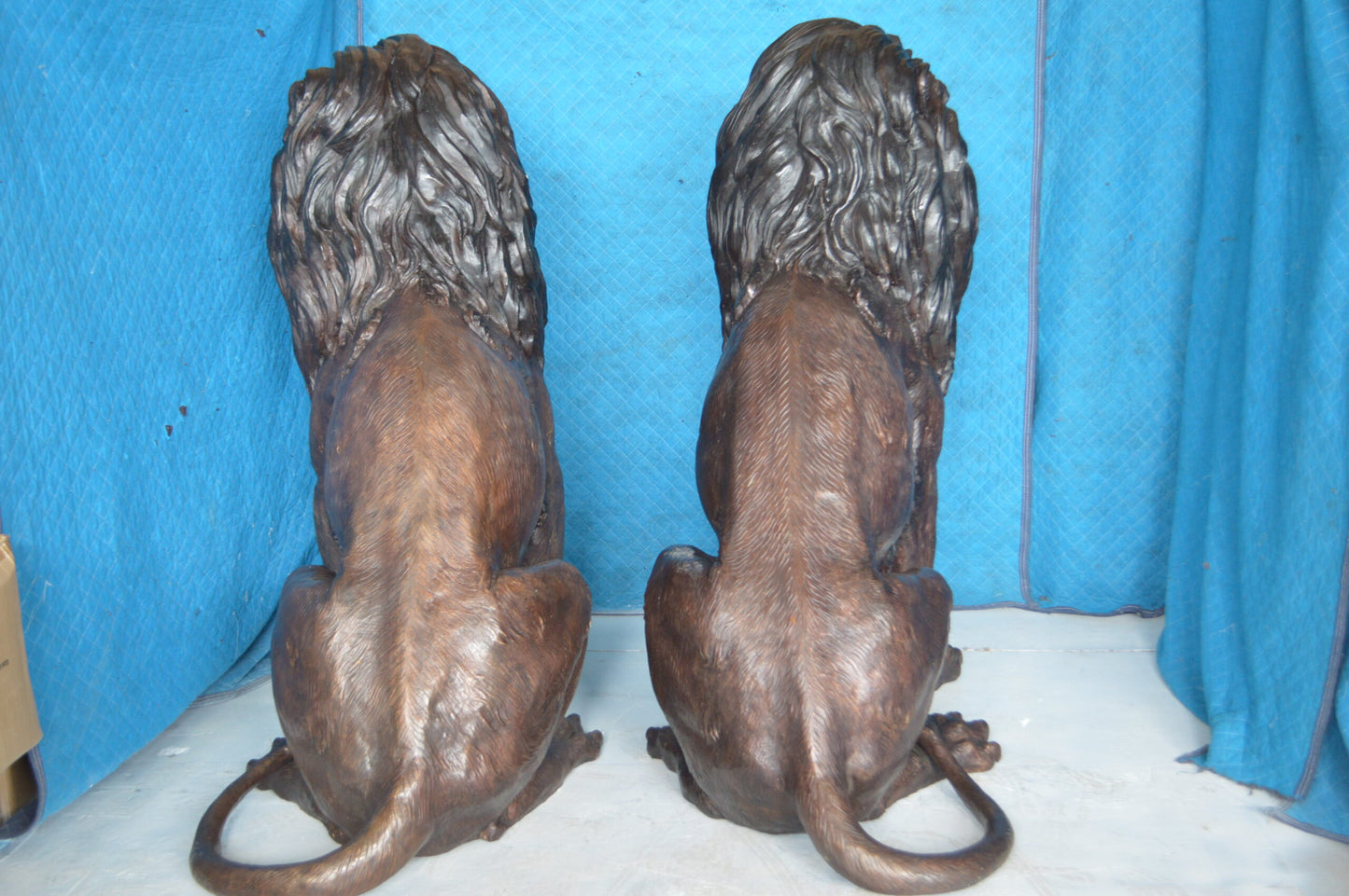 Pair of life size lion bronze statues - Size: 55"L x 28"W x 60"H.