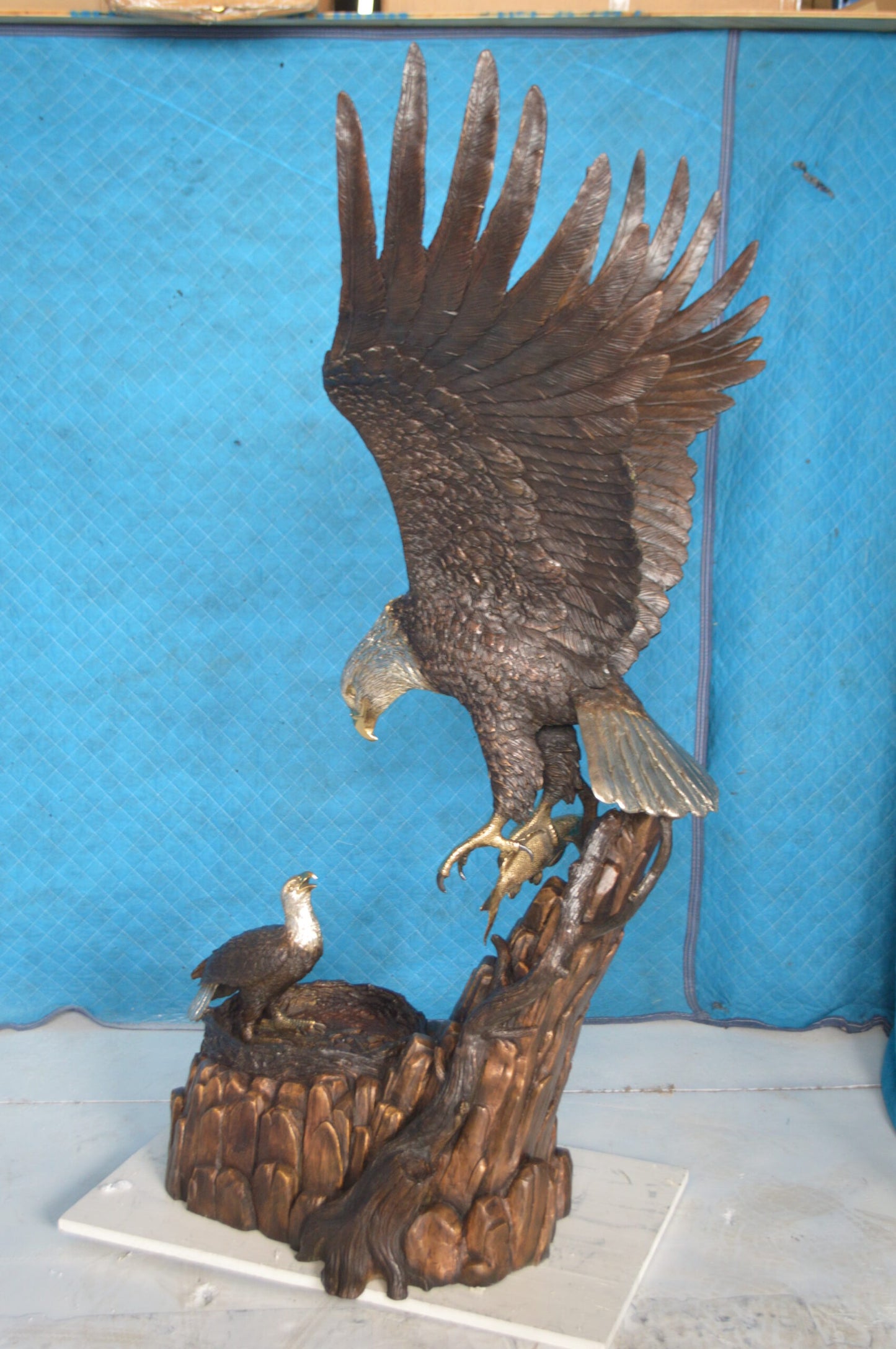 Eagle with nest Bronze Statue - Size: 36"L x 40"W x 63"H.