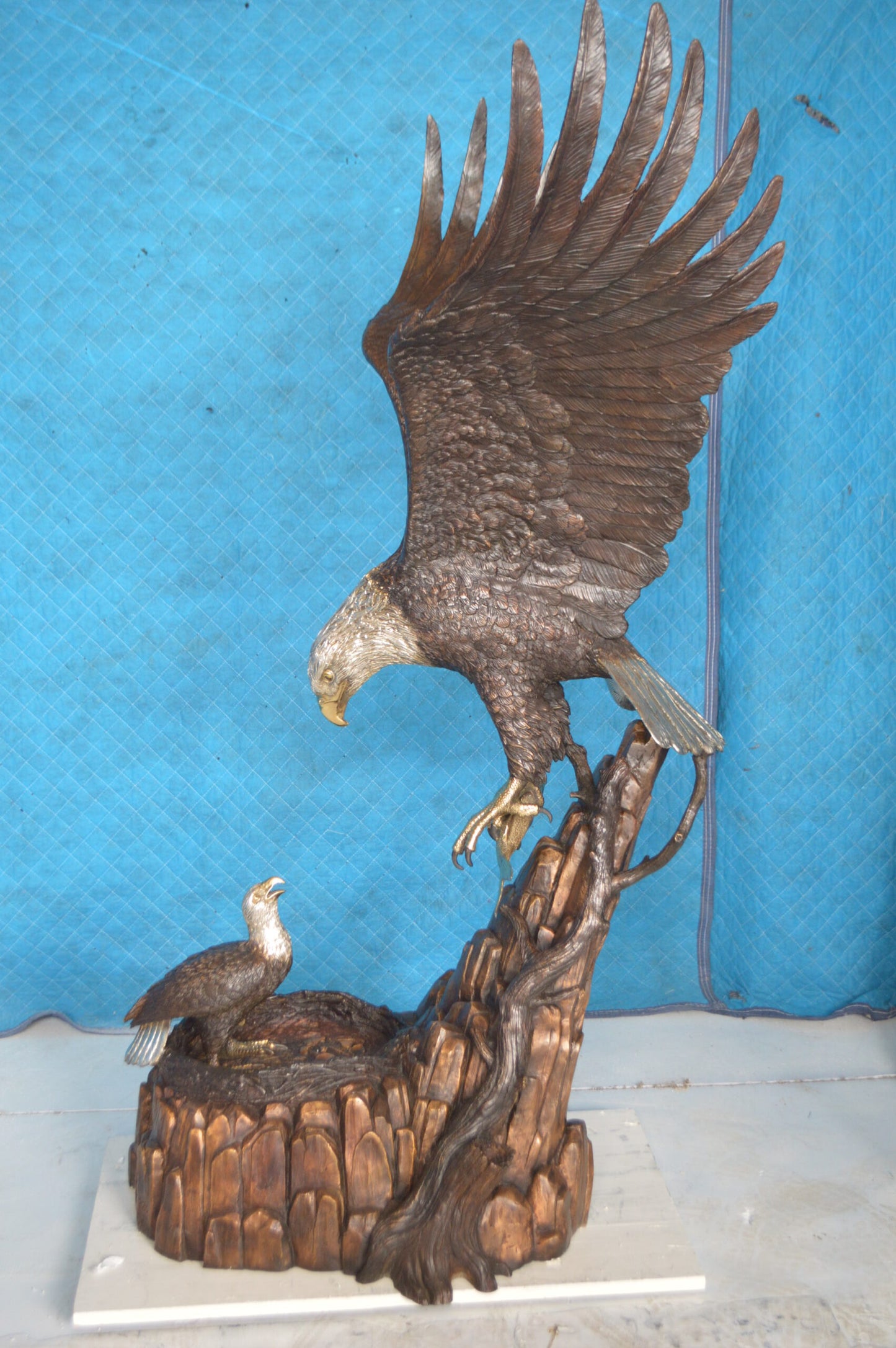 Eagle with nest Bronze Statue - Size: 36"L x 40"W x 63"H.