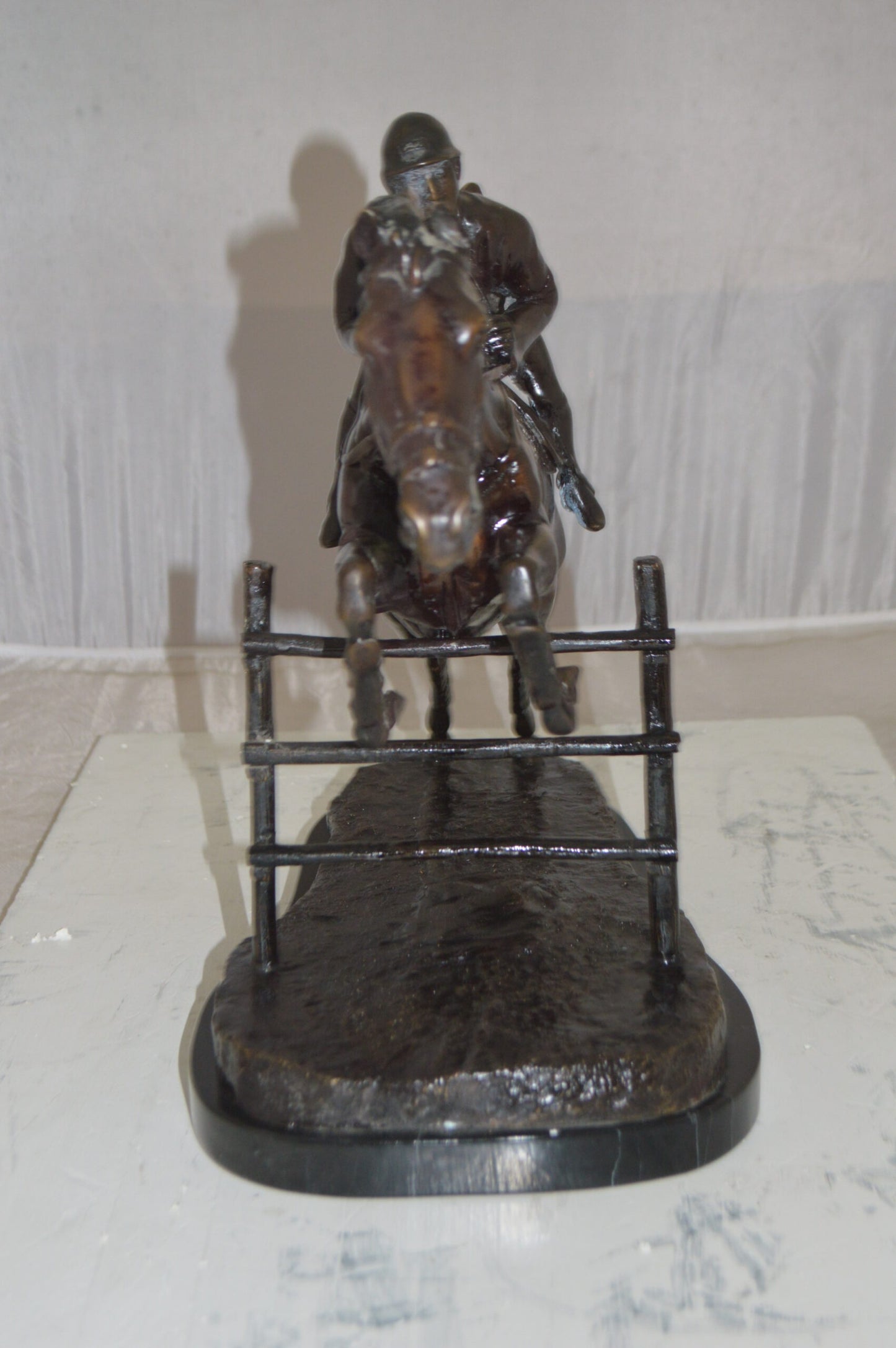 Jockey With Horse Jumping Over Hurdle Bronze Statue Medium 23"L x 10"W x 16"H.