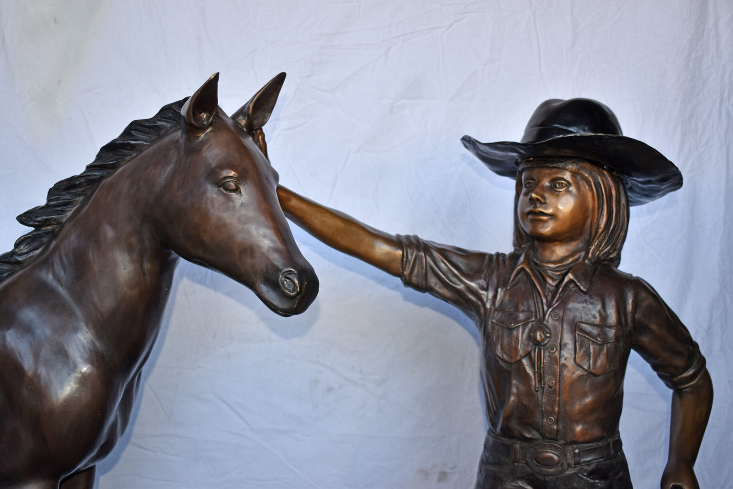 A Young Cowgirl with A Young Horse Bronze Statue Size: 60" x 30" x 44"H