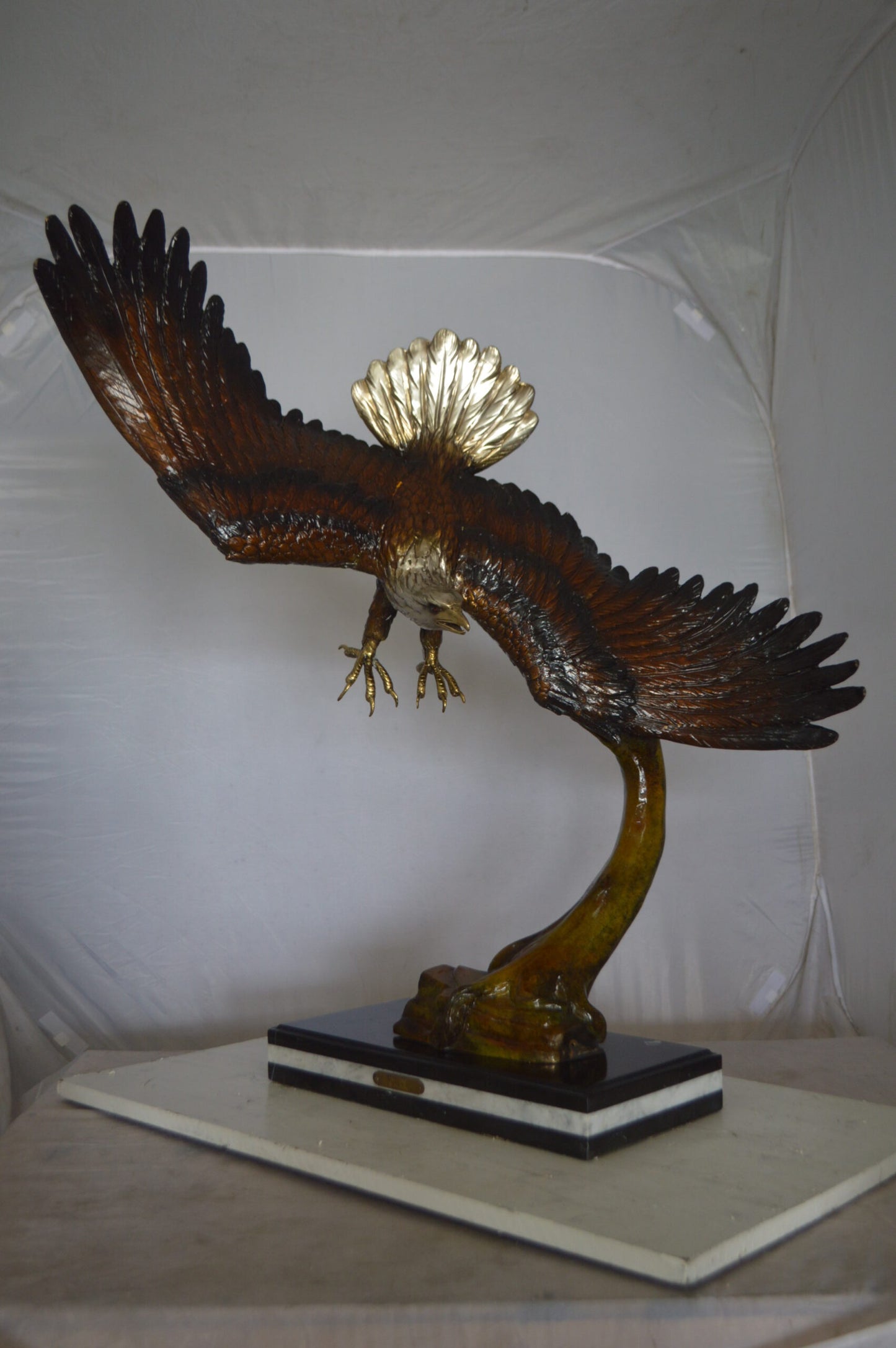 Eagle Soaring Bronze Statue by W Aribu - Size: 35"L x 27"W x 38"H.