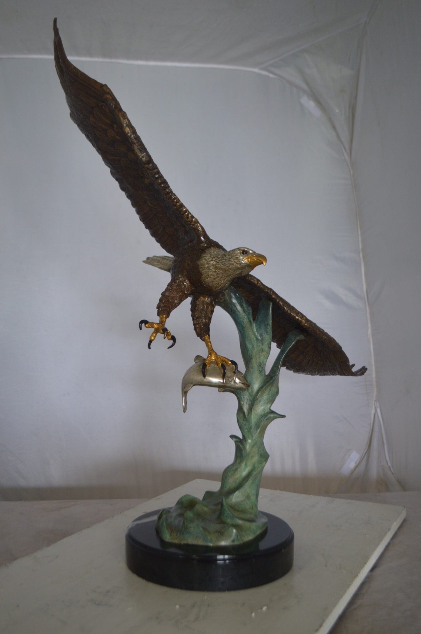Eagle Flying With His Pray Bronze Statue - Size: 32"L x 15"W x 33"H.