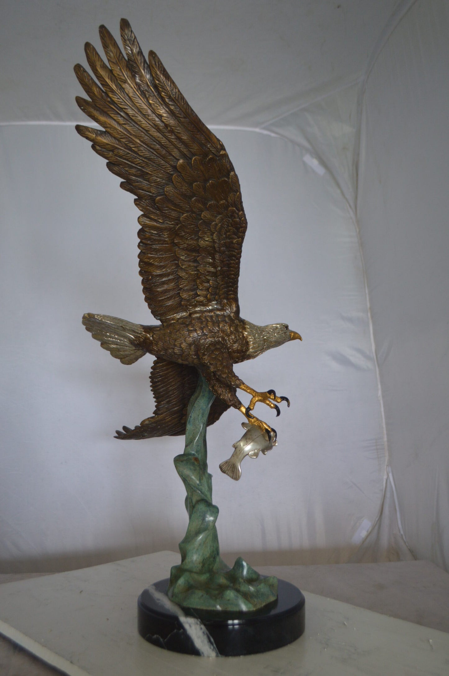 Eagle Flying With His Pray Bronze Statue -  Size: 32"L x 15"W x 33"H.
