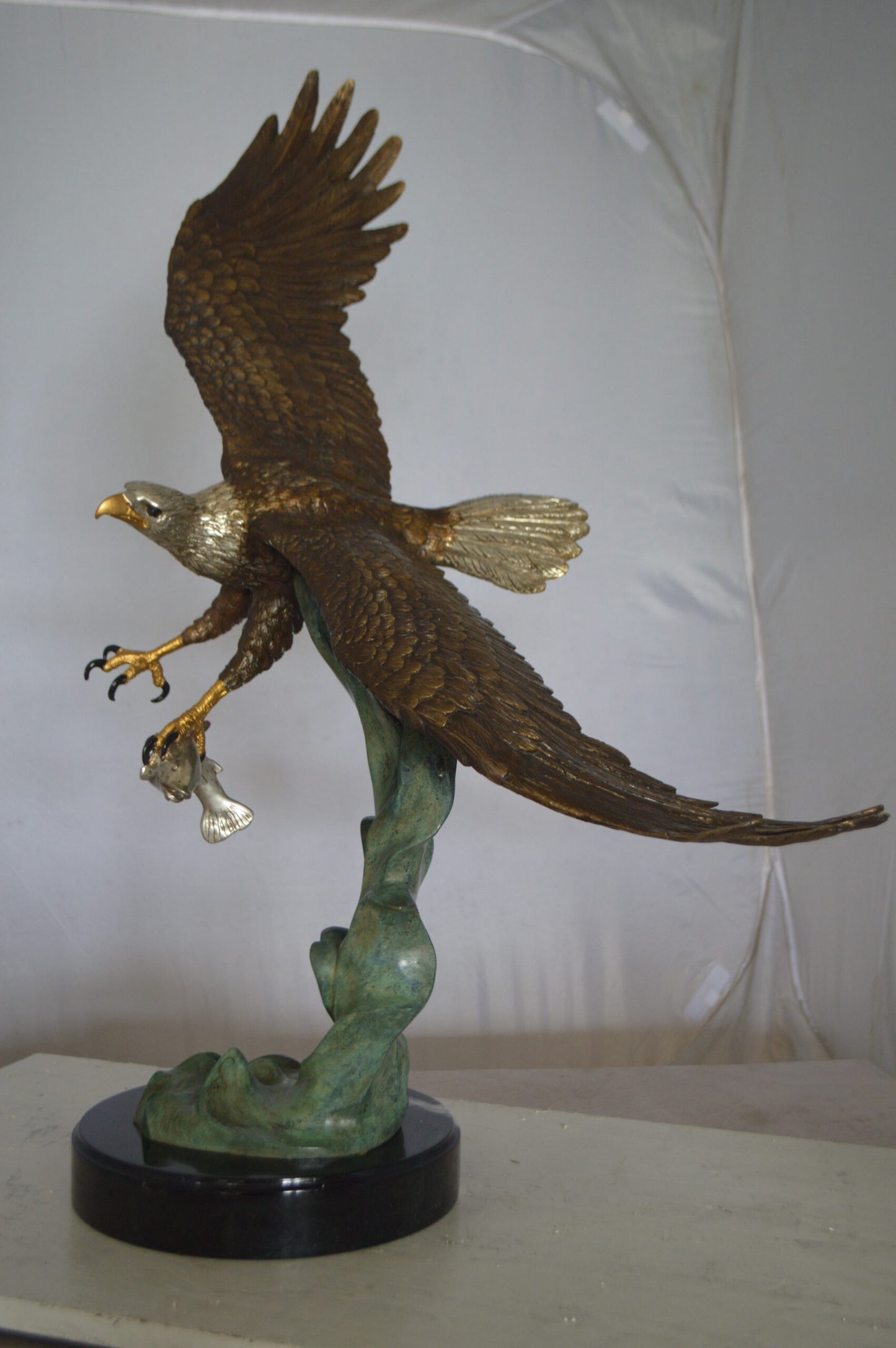 Eagle Flying With His Pray Bronze Statue - Size: 32"L x 15"W x 33"H.