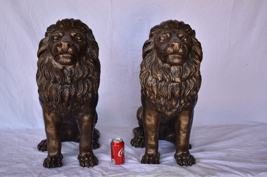 A Pair of Lions Sitting on The Ground Bronze Statues Size: 14" x 27" x 29"H