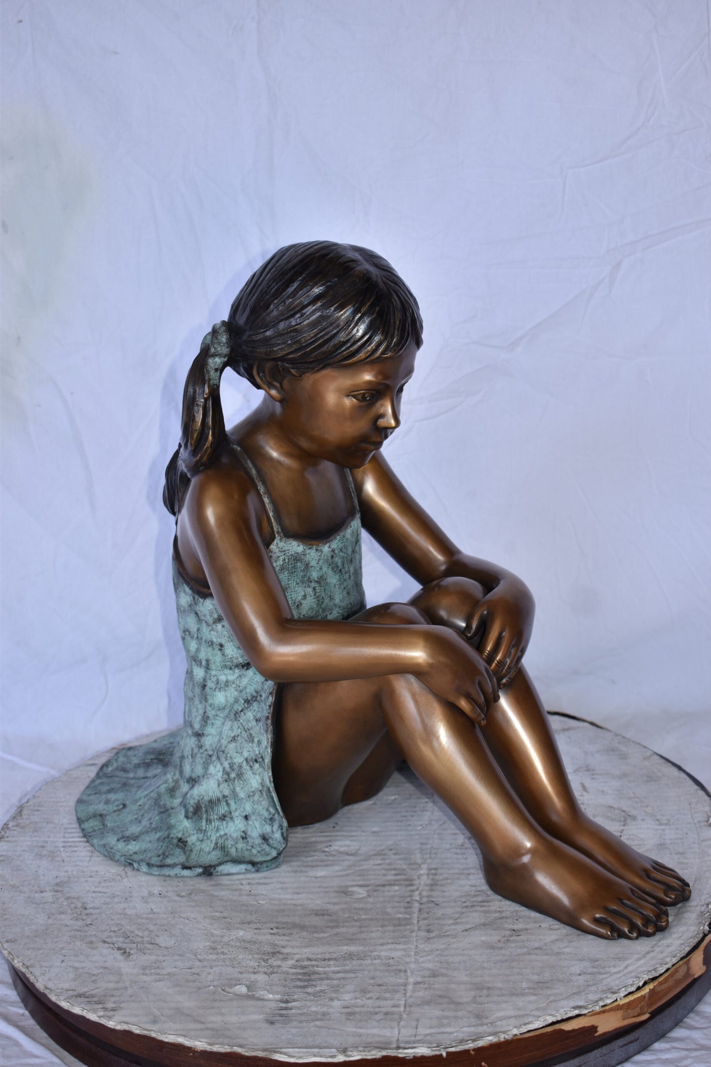 Girl Sitting on The Ground Enjoying the Sun Bronze Statues 22" x 15" x 19"H