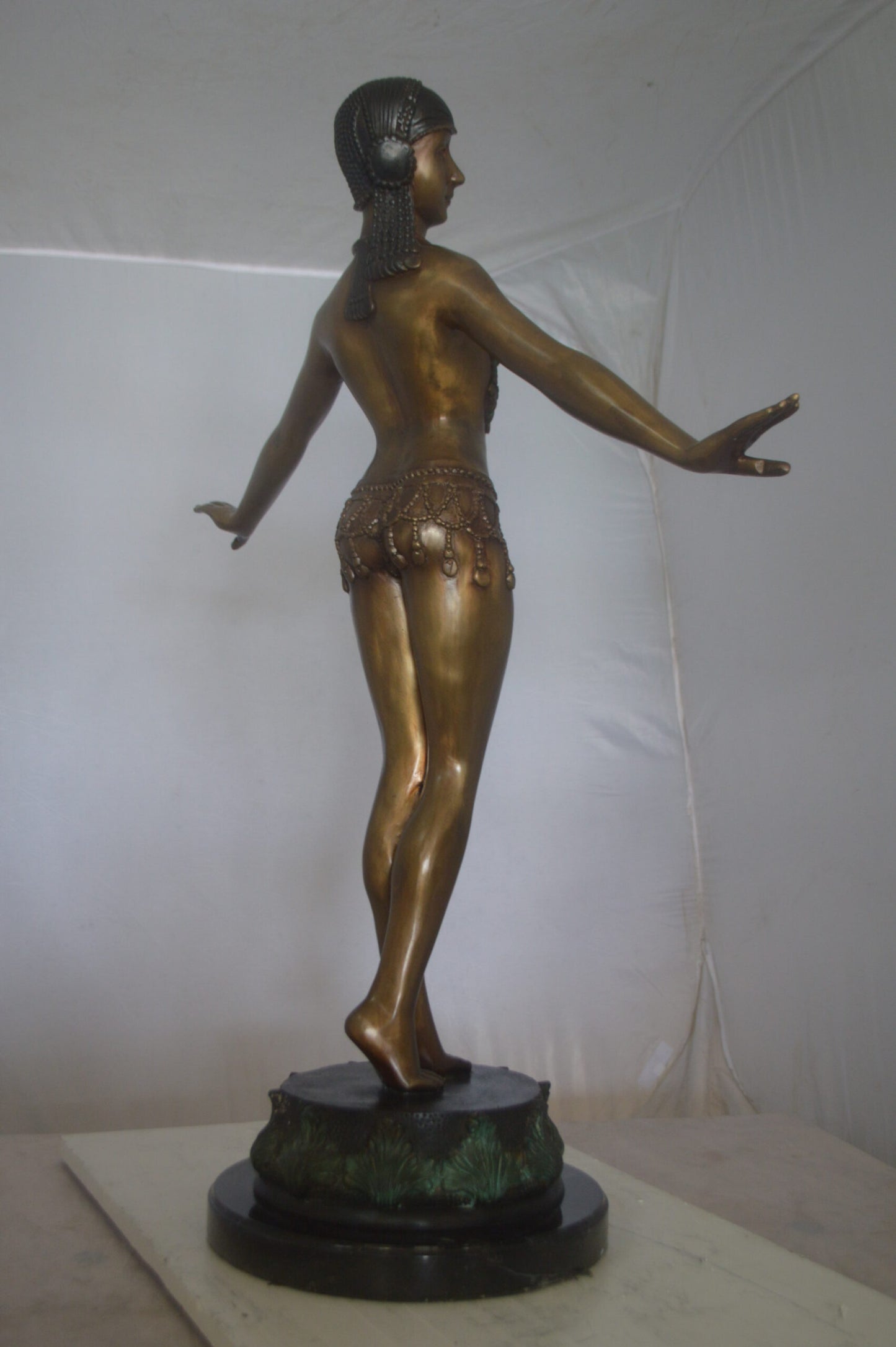 Belly Dancer Performing Bronze Statue -  Size: 32"L x 8"W x 41"H.