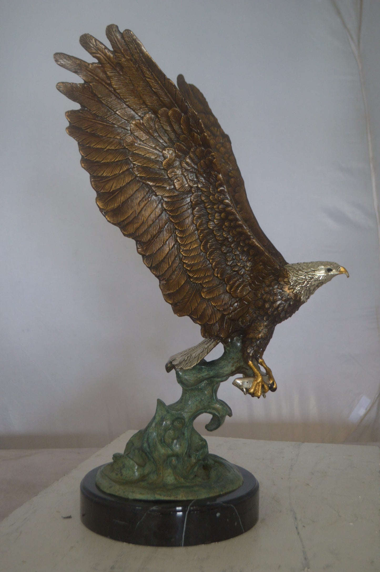 Eagle Catching His Prey from Water Bronze Statue -  Size: 14"L x 13"W x 26"H.