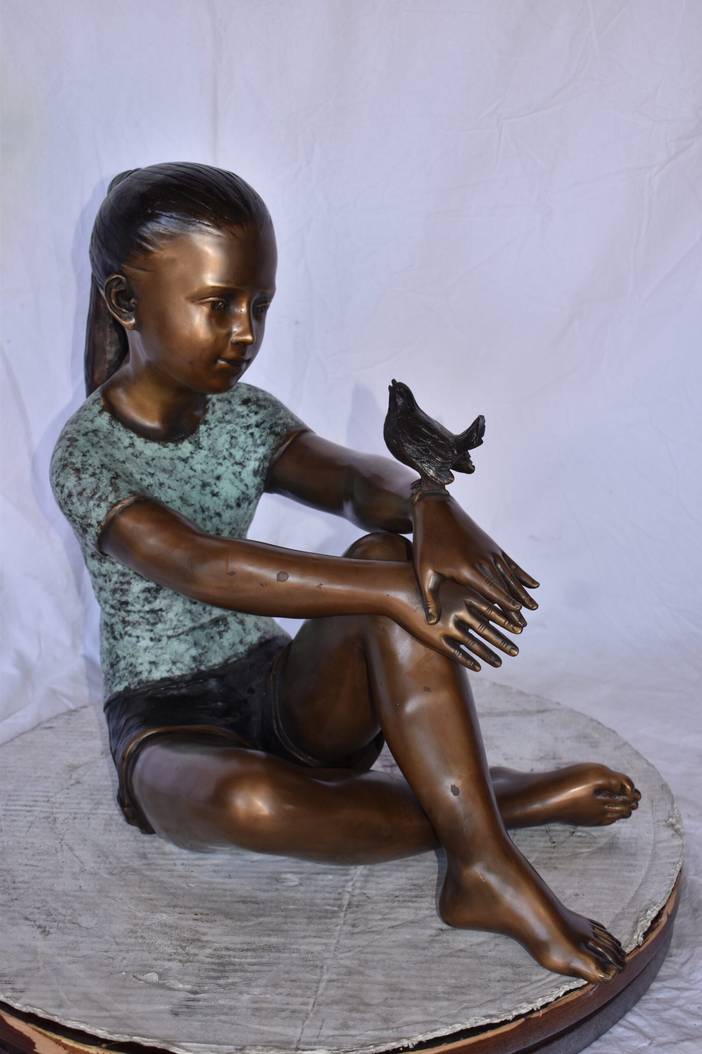 Girl Sitting with A Bird on Her Hand Bronze Statue Size: 23" x 13" x 21"H