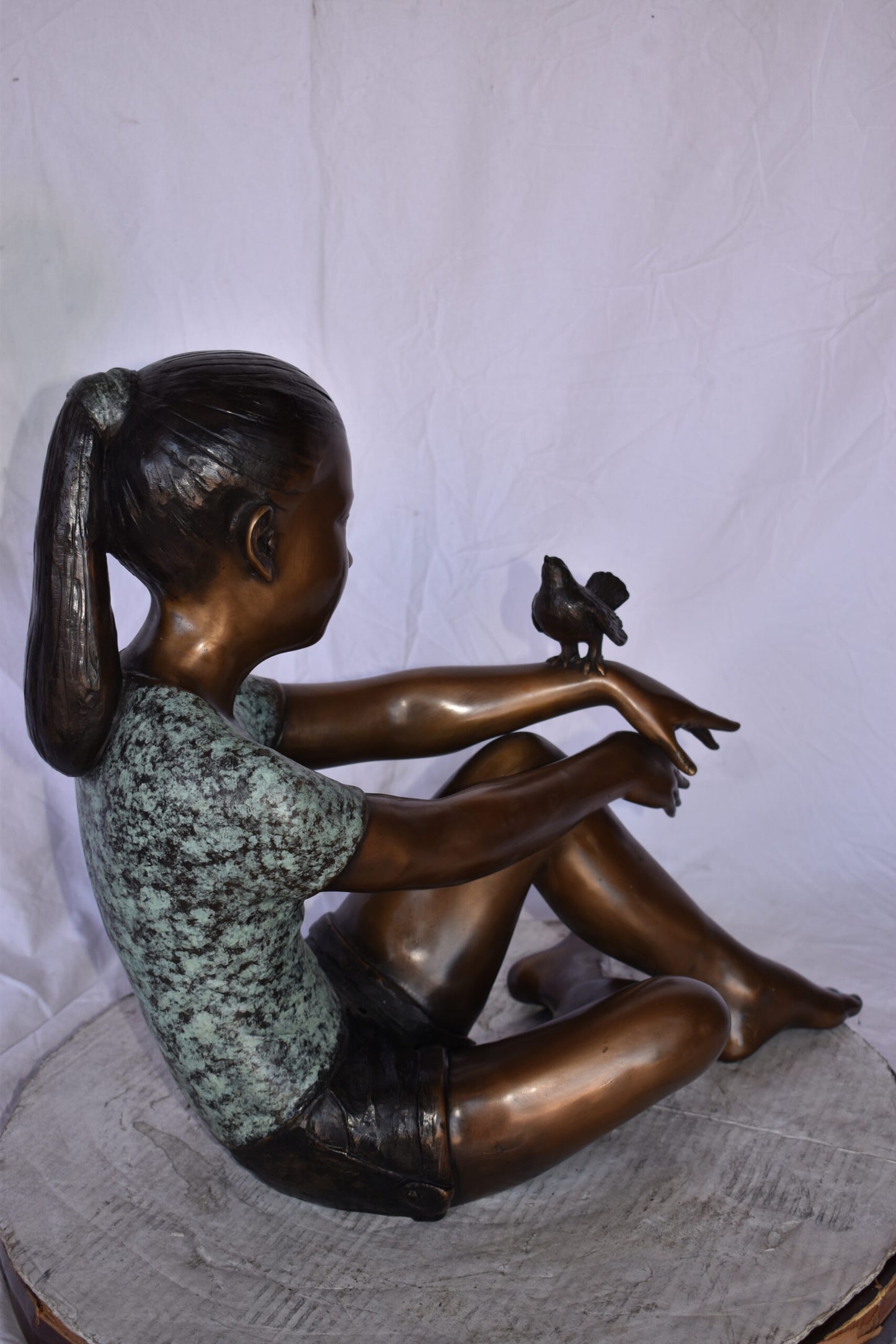 Girl Sitting with A Bird on Her Hand Bronze Statue Size: 23" x 13" x 21"H
