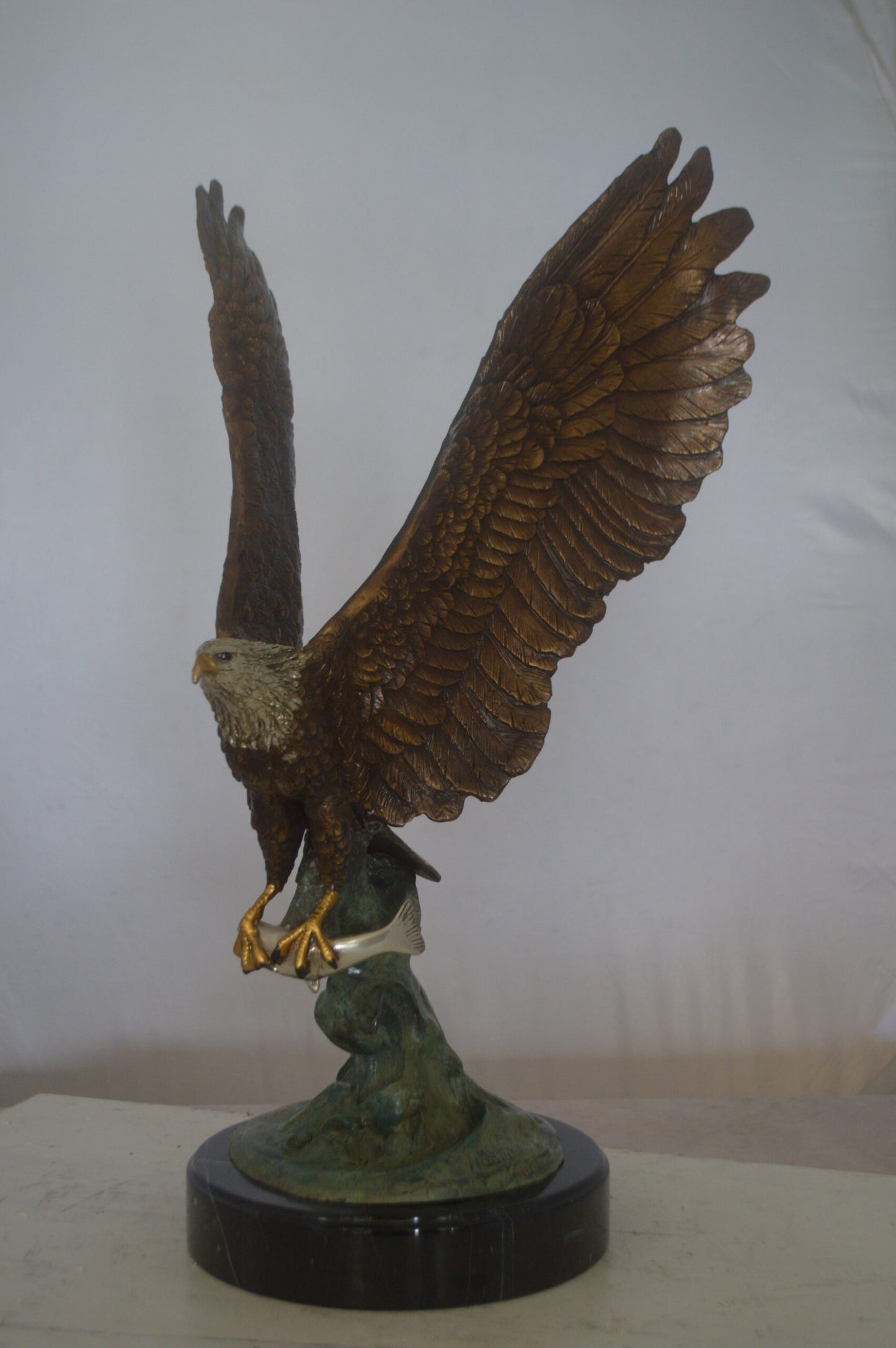Eagle Catching His Prey from Water Bronze Statue -  Size: 14"L x 13"W x 26"H.