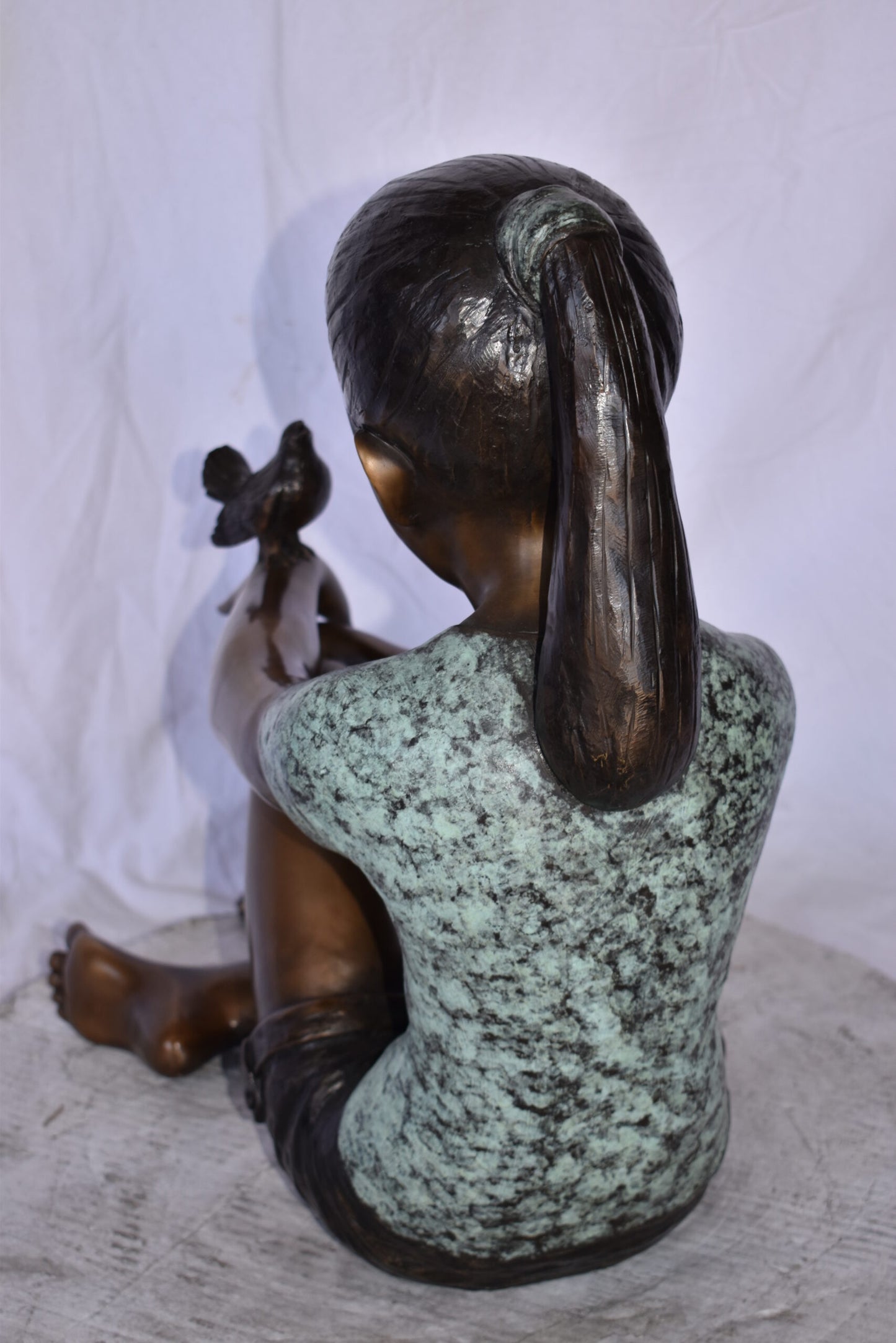 Girl Sitting with A Bird on Her Hand Bronze Statue Size: 23" x 13" x 21"H