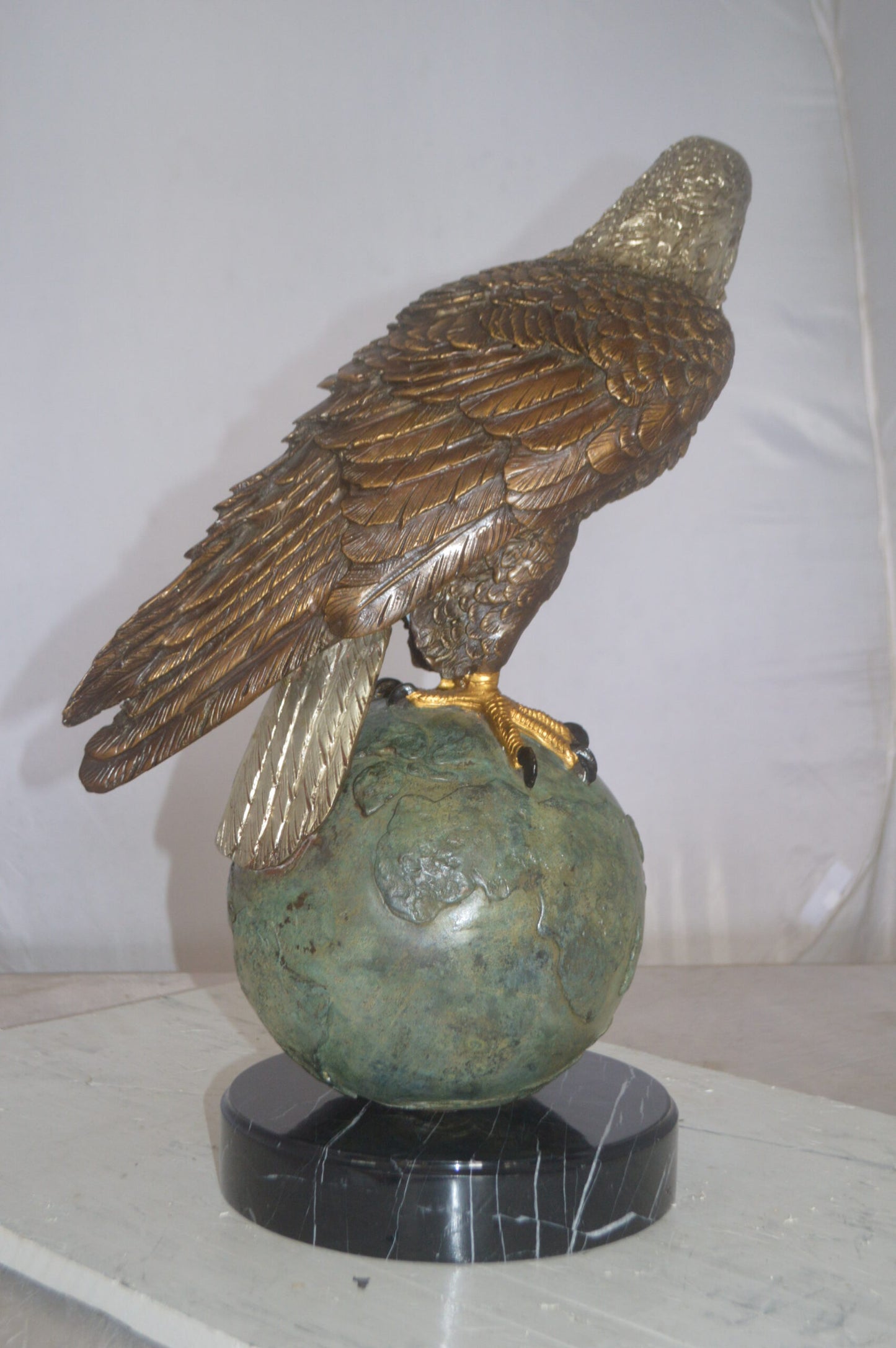 Bald Eagle Standing on a Globe Bronze Statue - Size: 17"L x 9"W x 23"H.