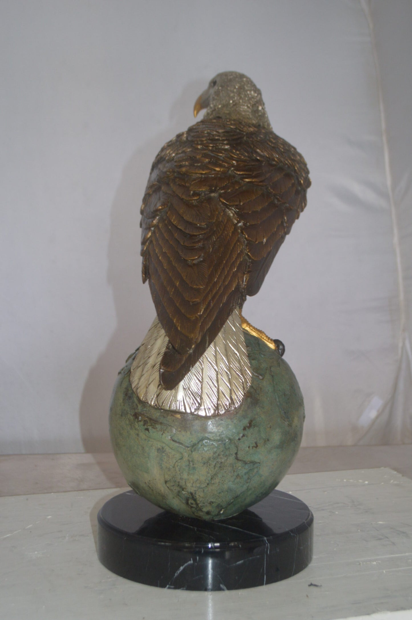 Bald Eagle Standing on a Globe Bronze Statue - Size: 17"L x 9"W x 23"H.