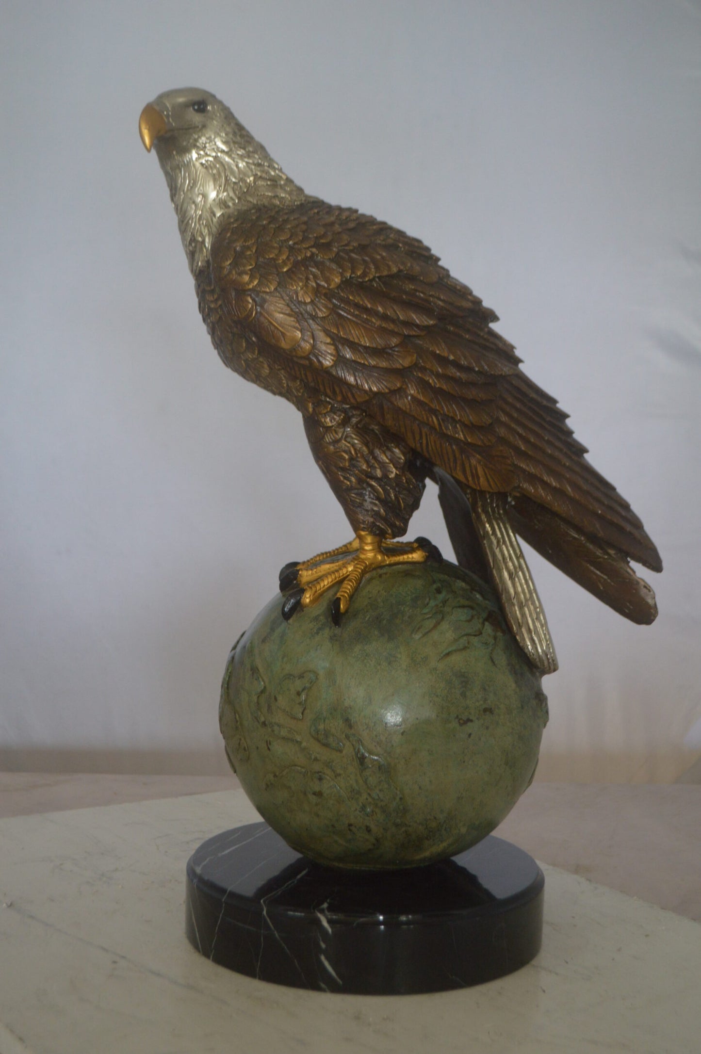 Bald Eagle Standing on a Globe Bronze Statue - Size: 17"L x 9"W x 23"H.