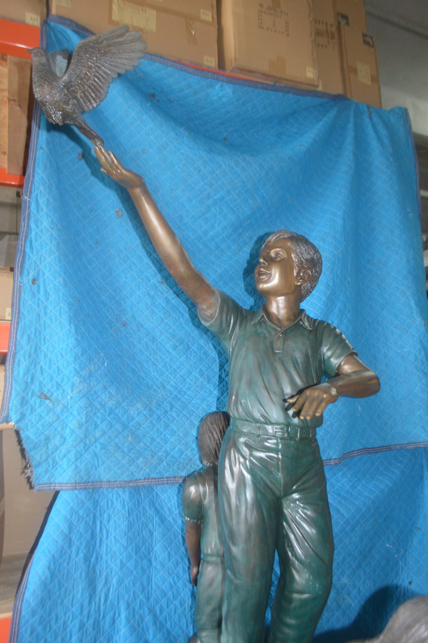 Four Kids Playing on a Rock Bronze Statue - Size: 49"L x 26"W x 89"H.