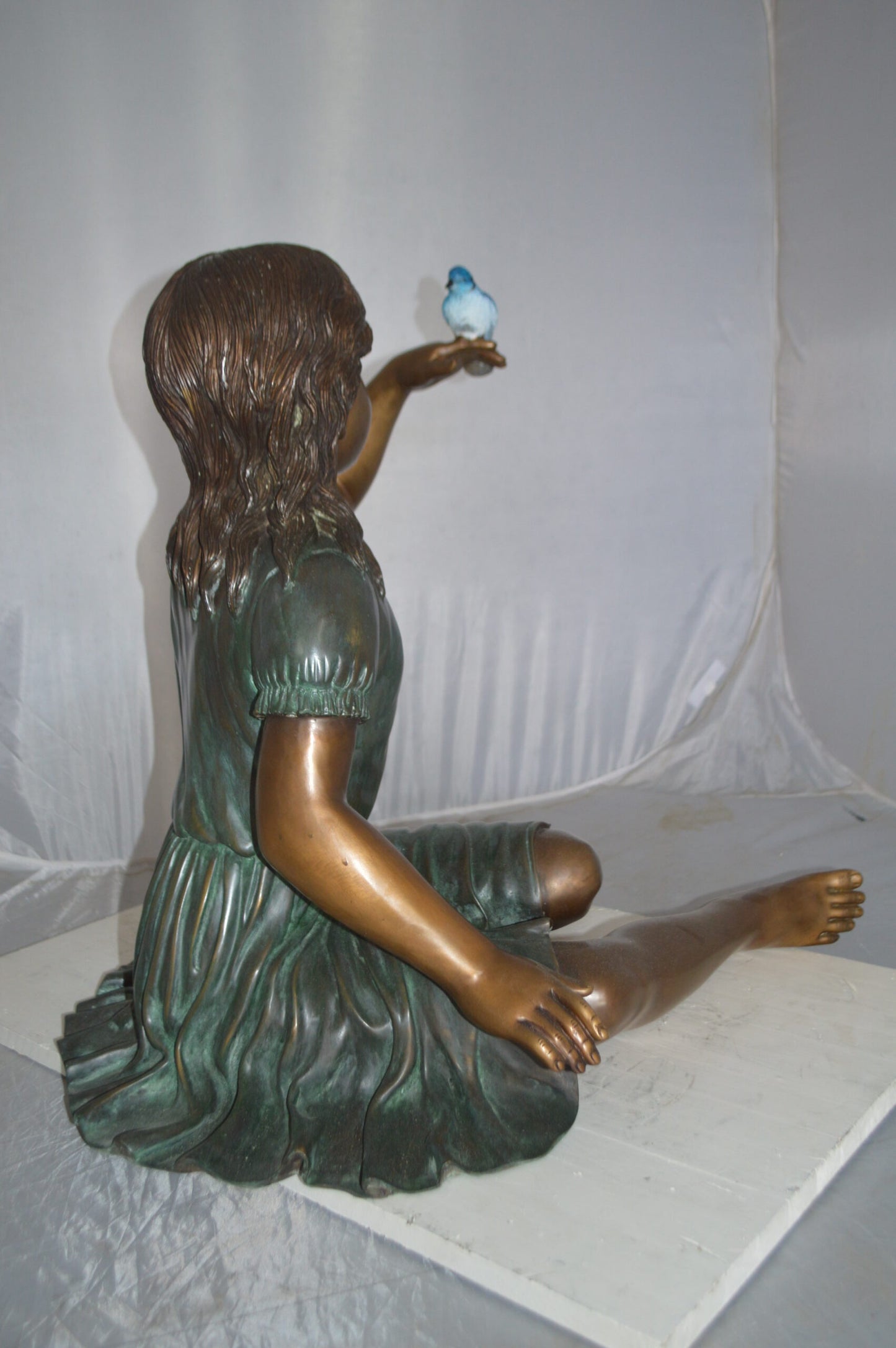 Girl with a Blue Sparrow Bronze Statue - Size: 26"L x 31"W x 25"H.