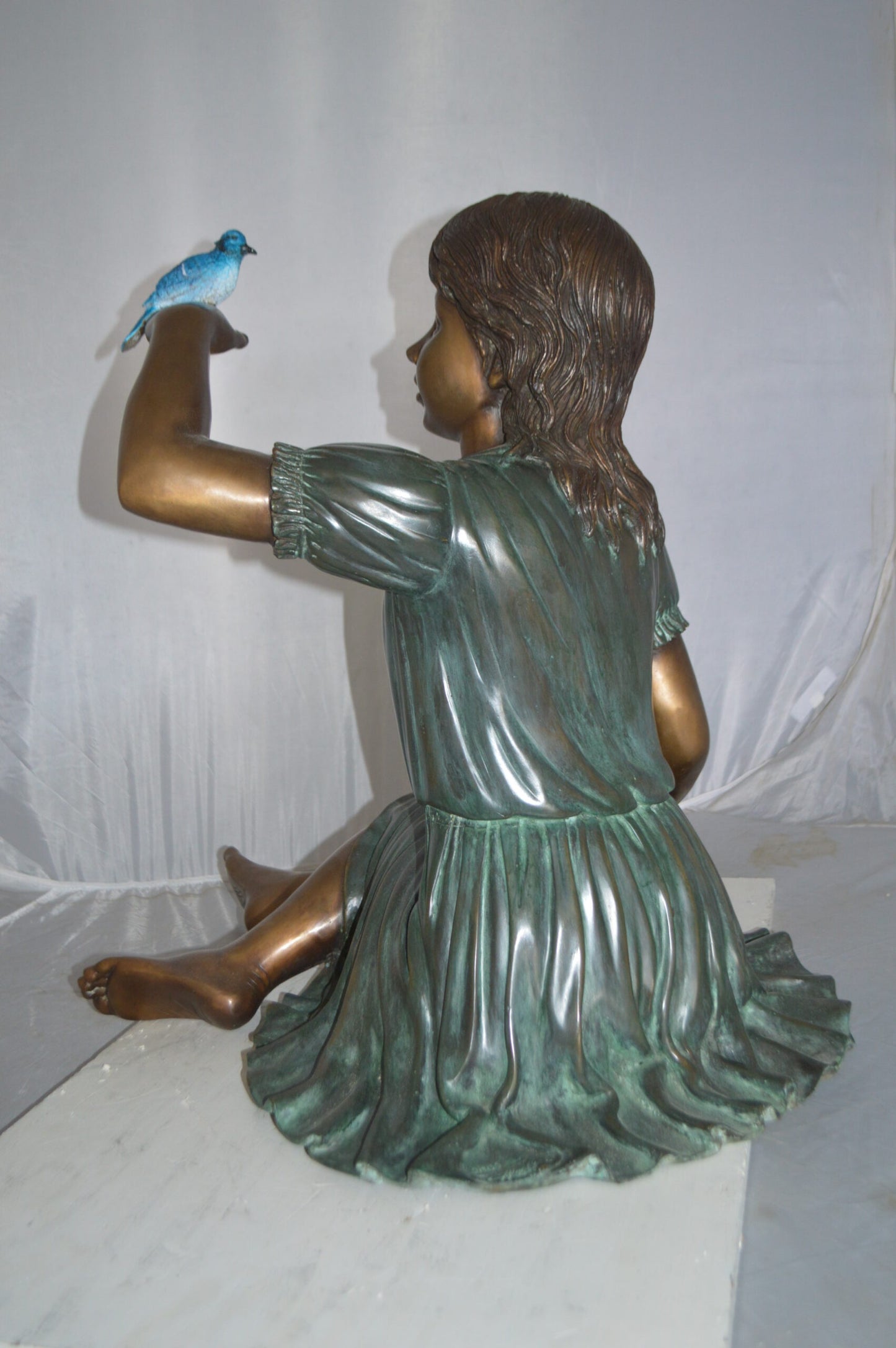 Girl with a Blue Sparrow Bronze Statue - Size: 26"L x 31"W x 25"H.