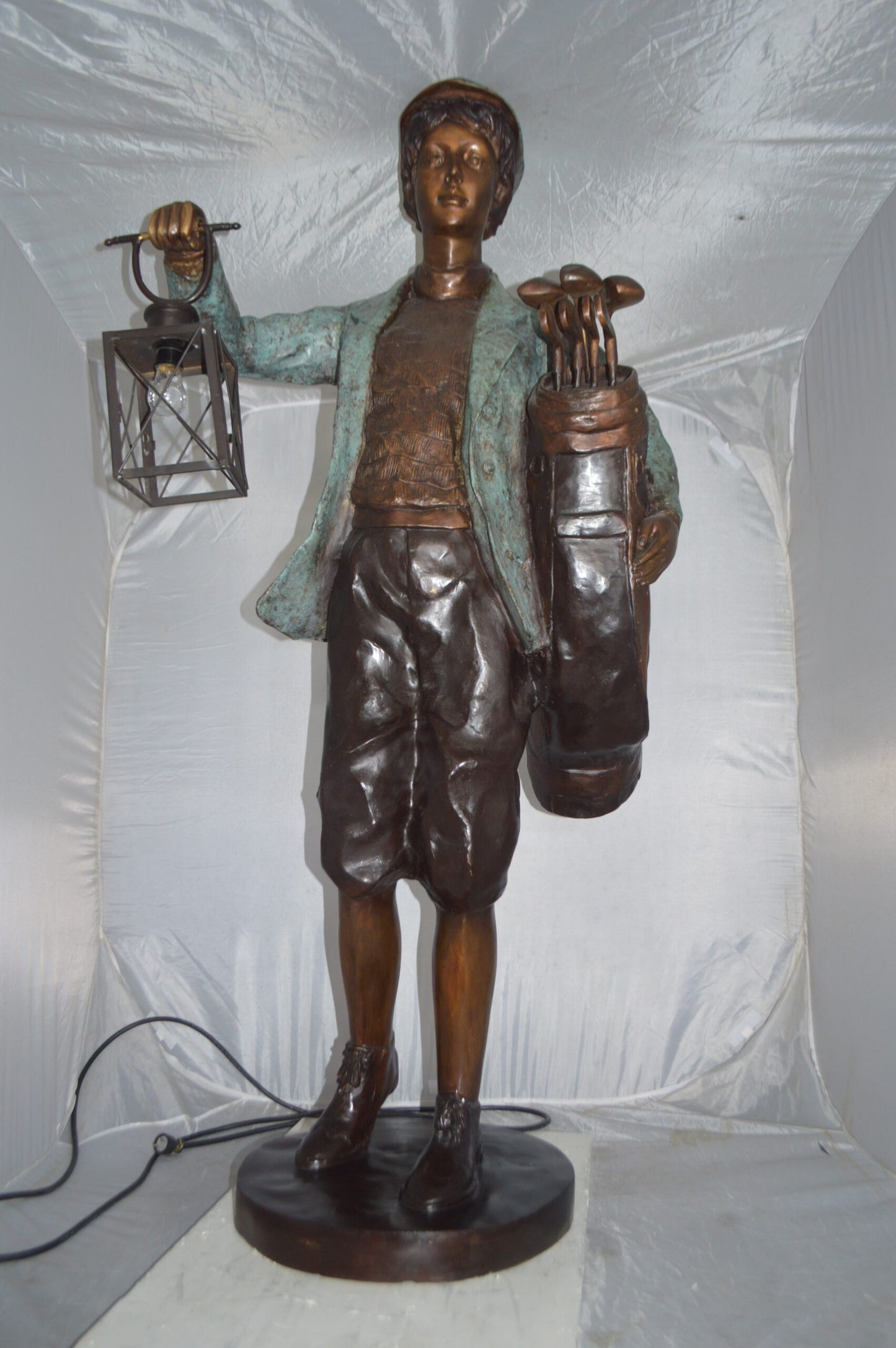 Caddy with light Bronze Statue - Size: 30"L x 36"W x 64"H.