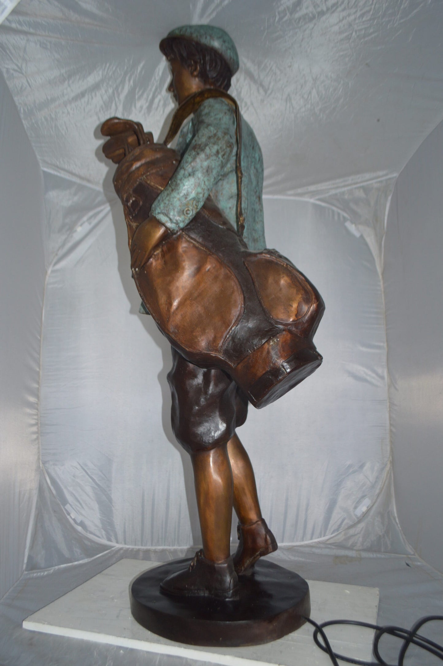Caddy with light Bronze Statue - Size: 30"L x 36"W x 64"H.
