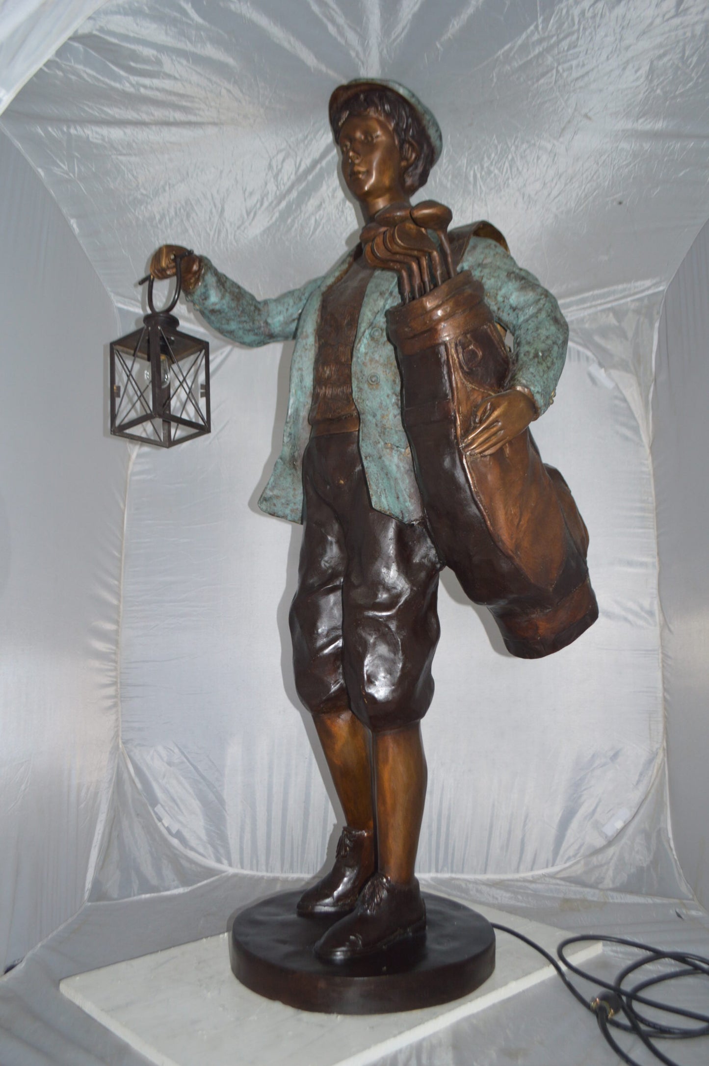 Caddy with light Bronze Statue - Size: 30"L x 36"W x 64"H.
