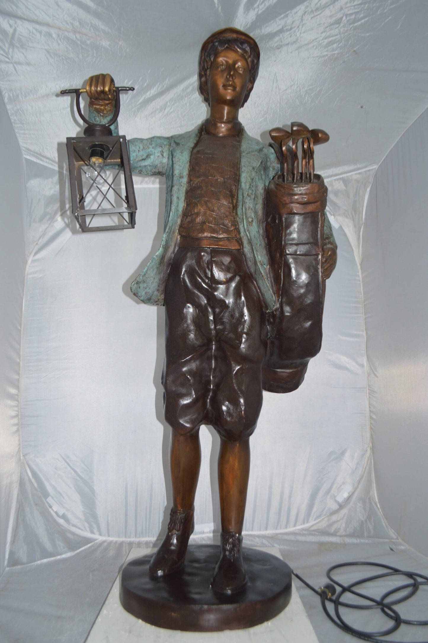 Caddy with light Bronze Statue - Size: 30"L x 36"W x 64"H.