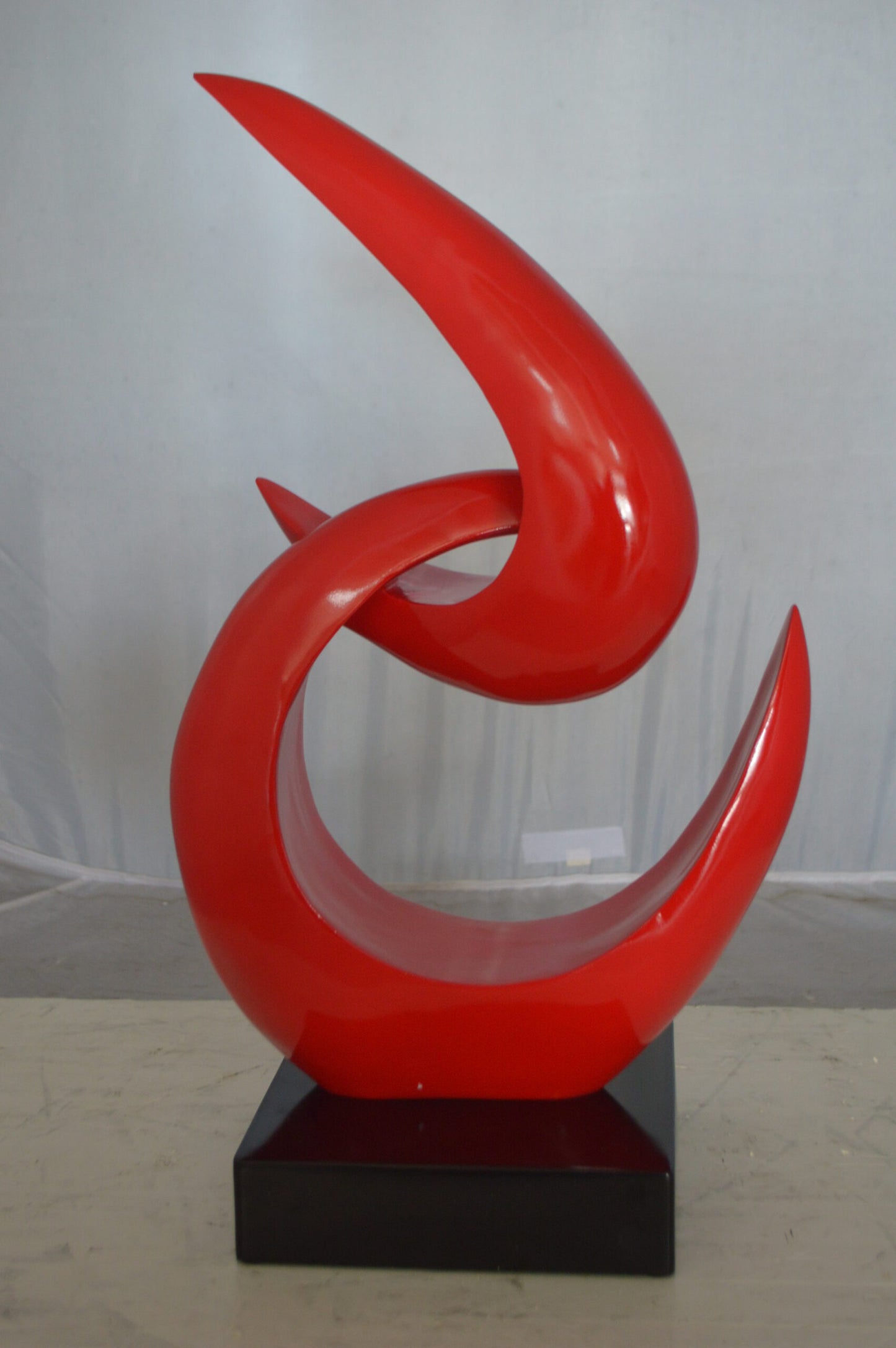 Modern Art Red Boomerang Statue made of Resin - Size: 13"L x 8"W x 23"H.