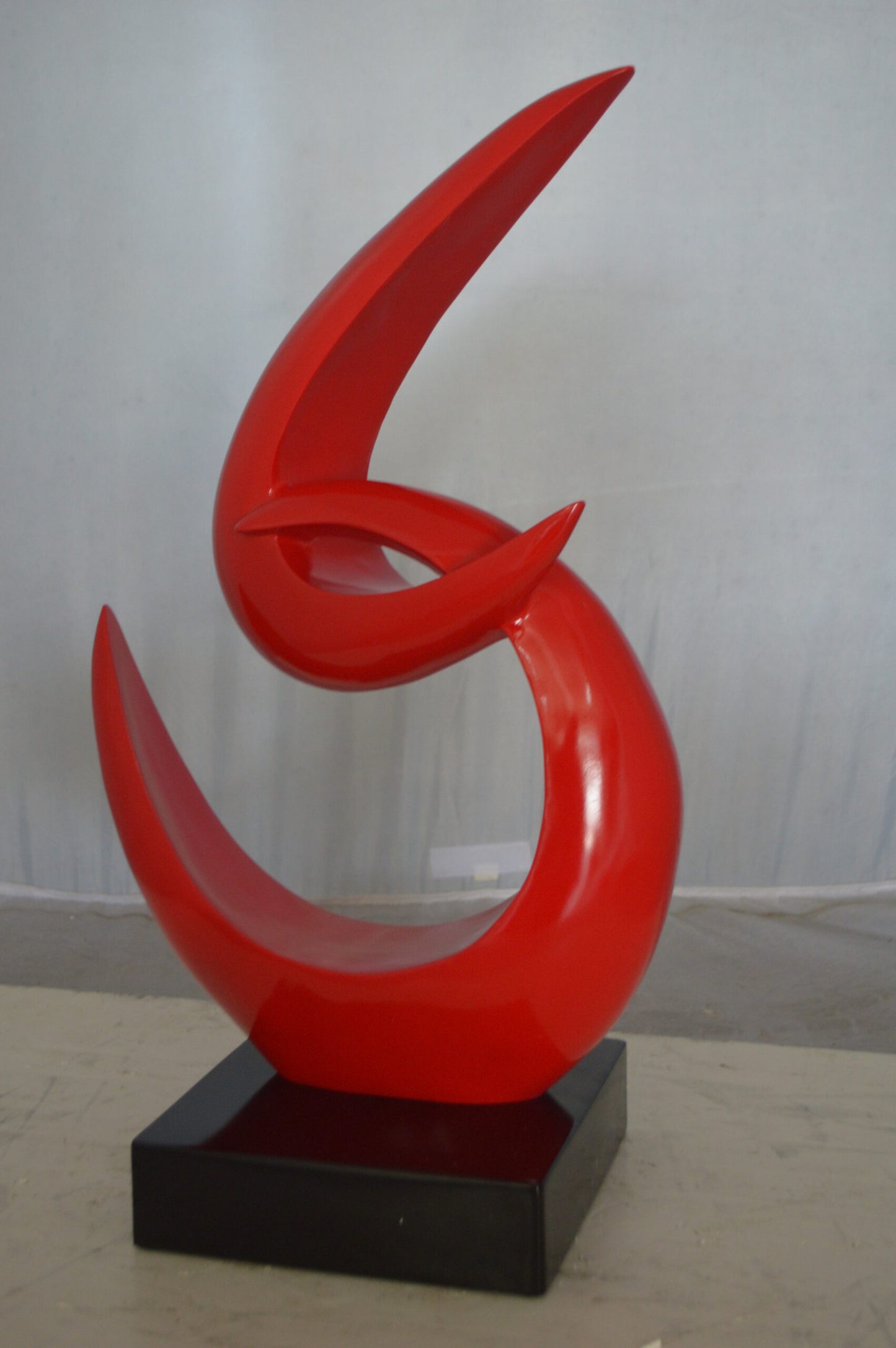 Modern Art Red Boomerang Statue made of Resin - Size: 13"L x 8"W x 23"H.