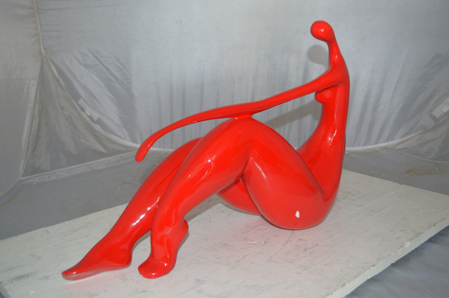 Modern Art Red Women on the Beach Resin Statue - Size: 27"L x 8"W x 15"H.
