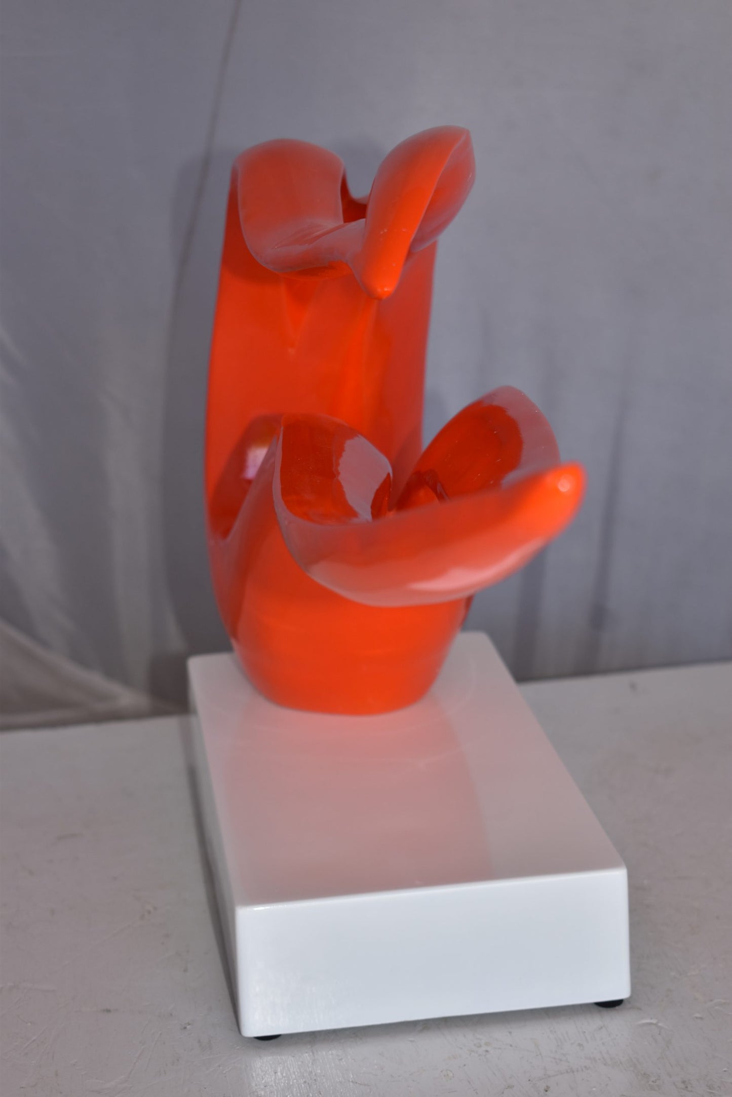 Modern Art Orange Ribbon Resin Statue Mounted on A Base Size: 25" x 6" x 13"H