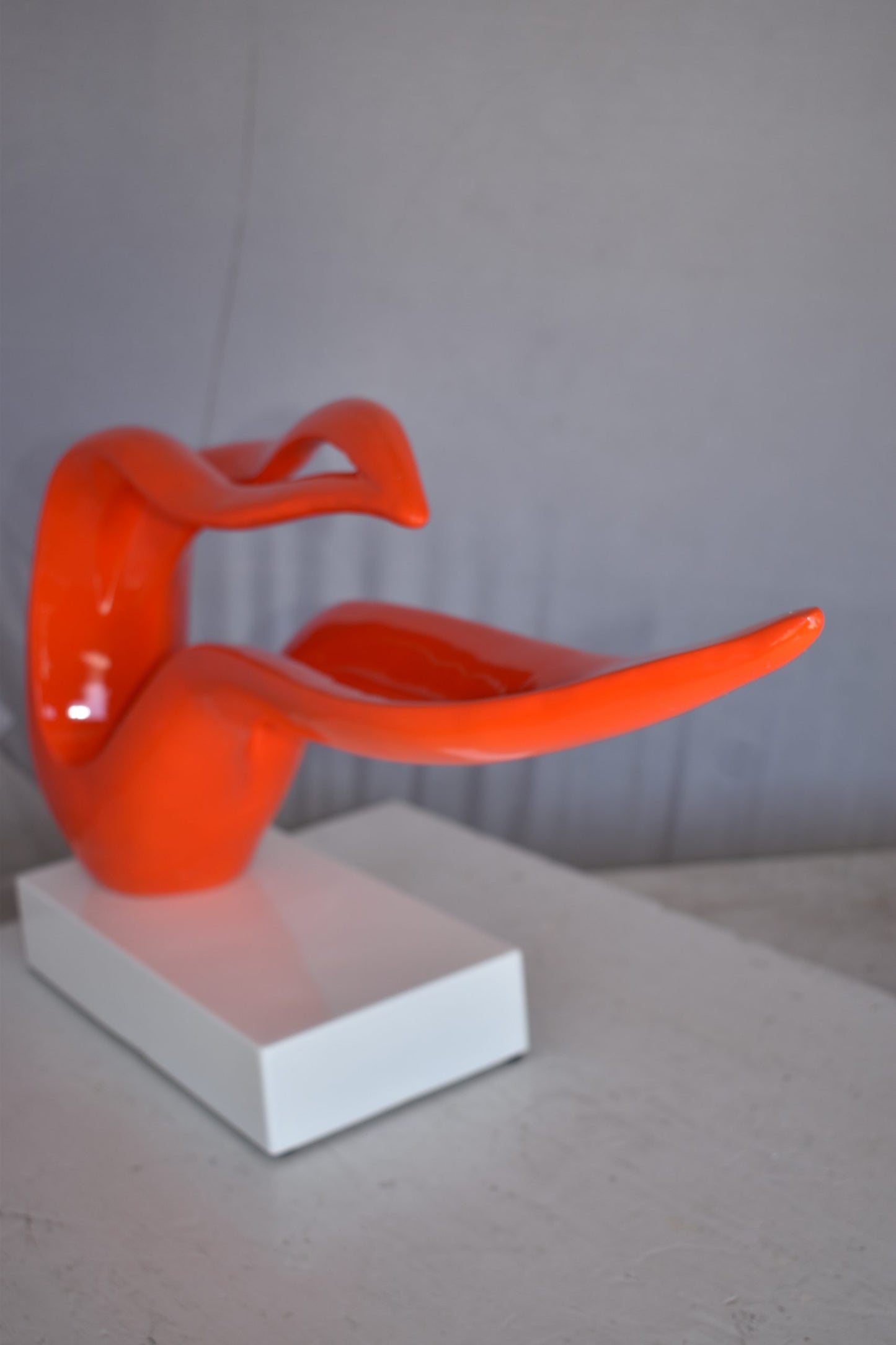 Modern Art Orange Ribbon Resin Statue Mounted on A Base Size: 25" x 6" x 13"H
