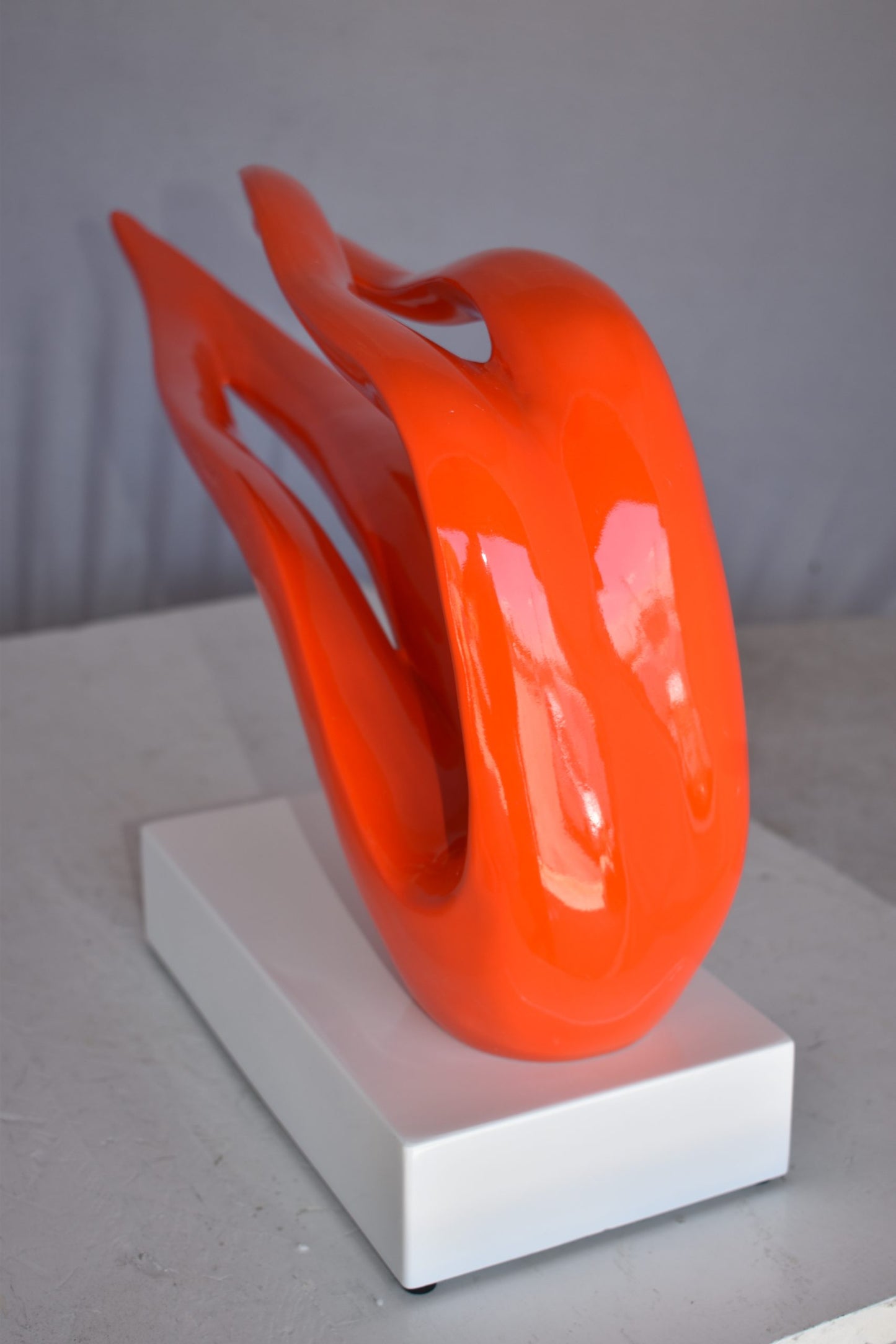 Modern Art Orange Ribbon Resin Statue Mounted on A Base Size: 25" x 6" x 13"H