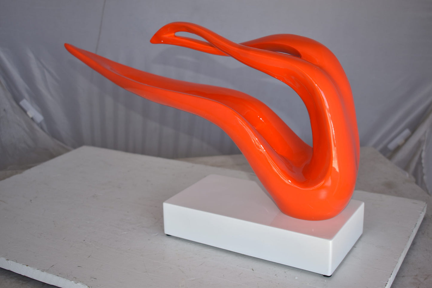 Modern Art Orange Ribbon Resin Statue Mounted on A Base Size: 25" x 6" x 13"H