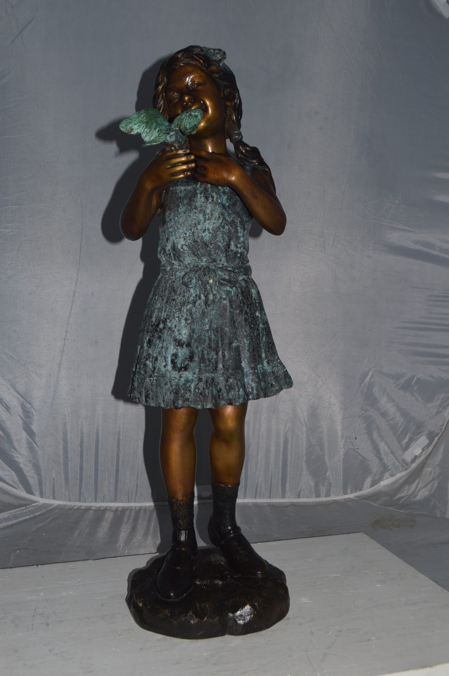 Girl Holding a Bird Bronze Statue - Size: 12"L x 12"W x 34"H.