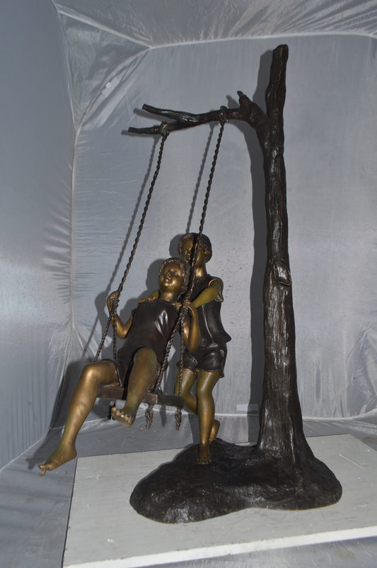 Kids Playing on a Swing bronze Statue -  Size: 22"L x 25"W x 43"H.