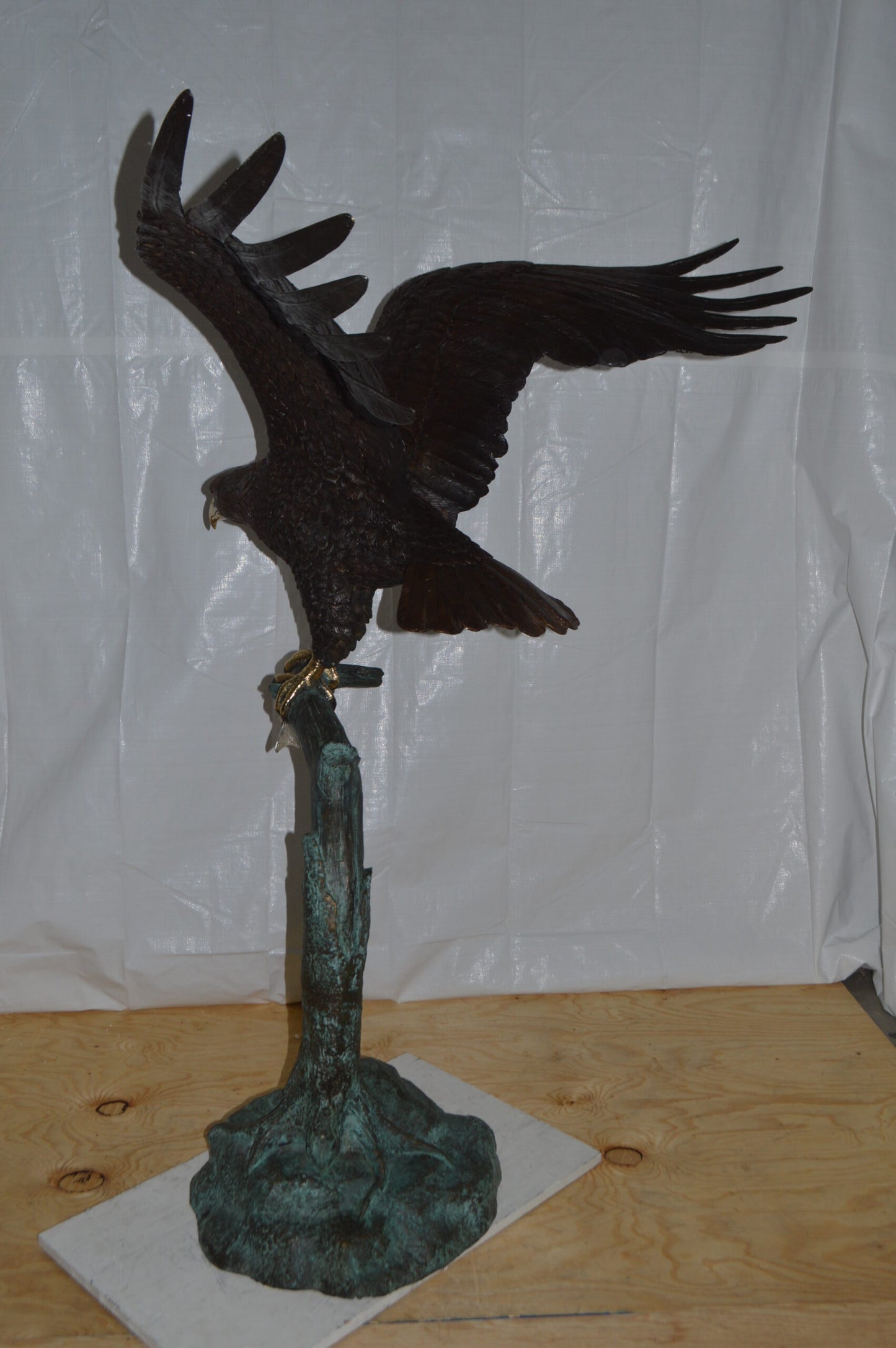 Eagle on a Tree Branch Bronze Statue - Size: 44"L x 50"W x 65"H.