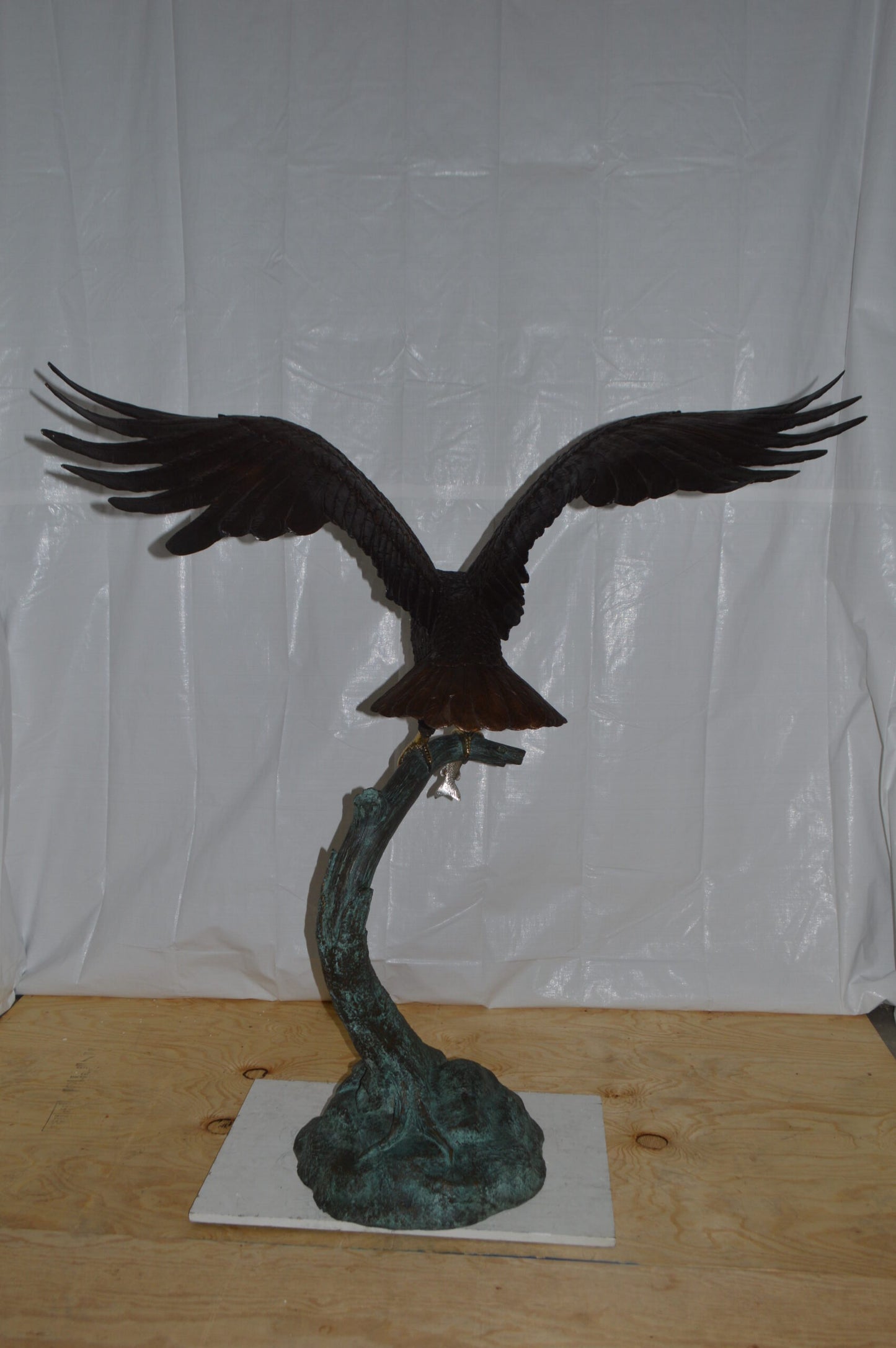 Eagle on a Tree Branch Bronze Statue - Size: 44"L x 50"W x 65"H.