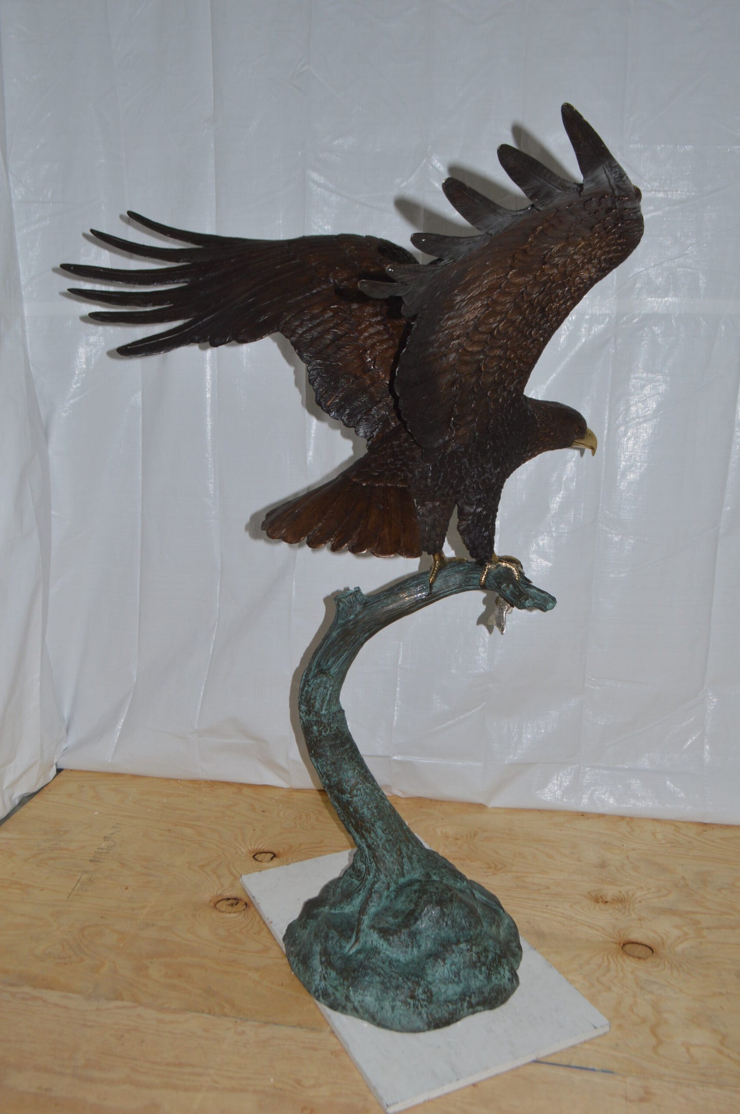 Eagle on a Tree Branch Bronze Statue - Size: 44"L x 50"W x 65"H.