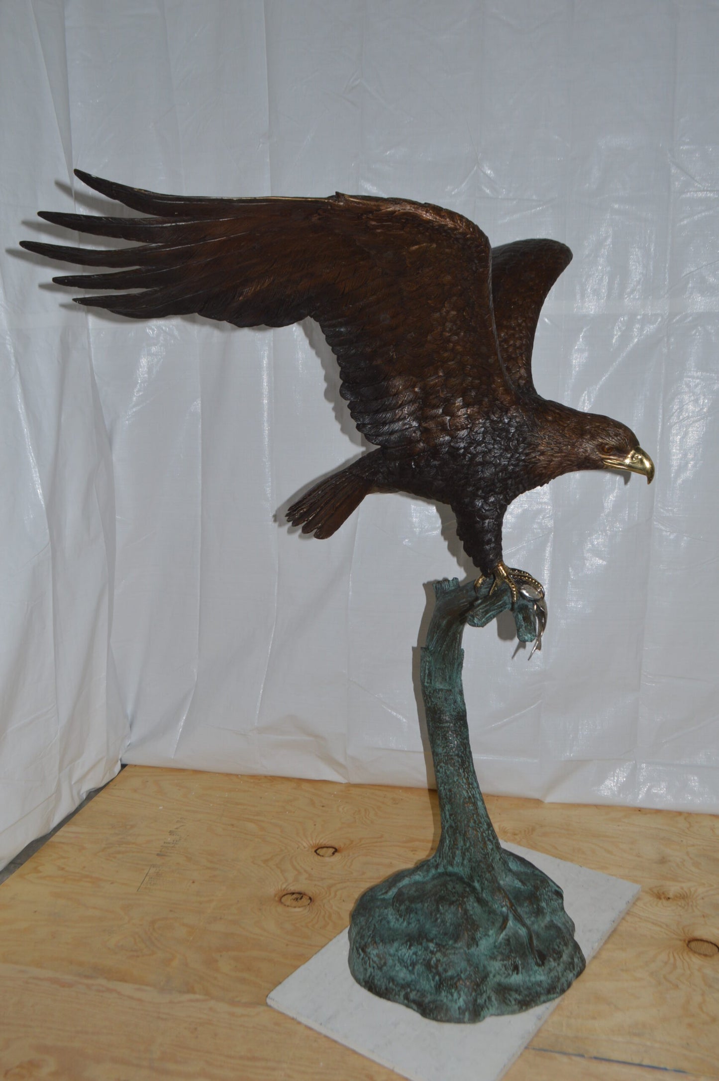 Eagle on a Tree Branch Bronze Statue - Size: 44"L x 50"W x 65"H.