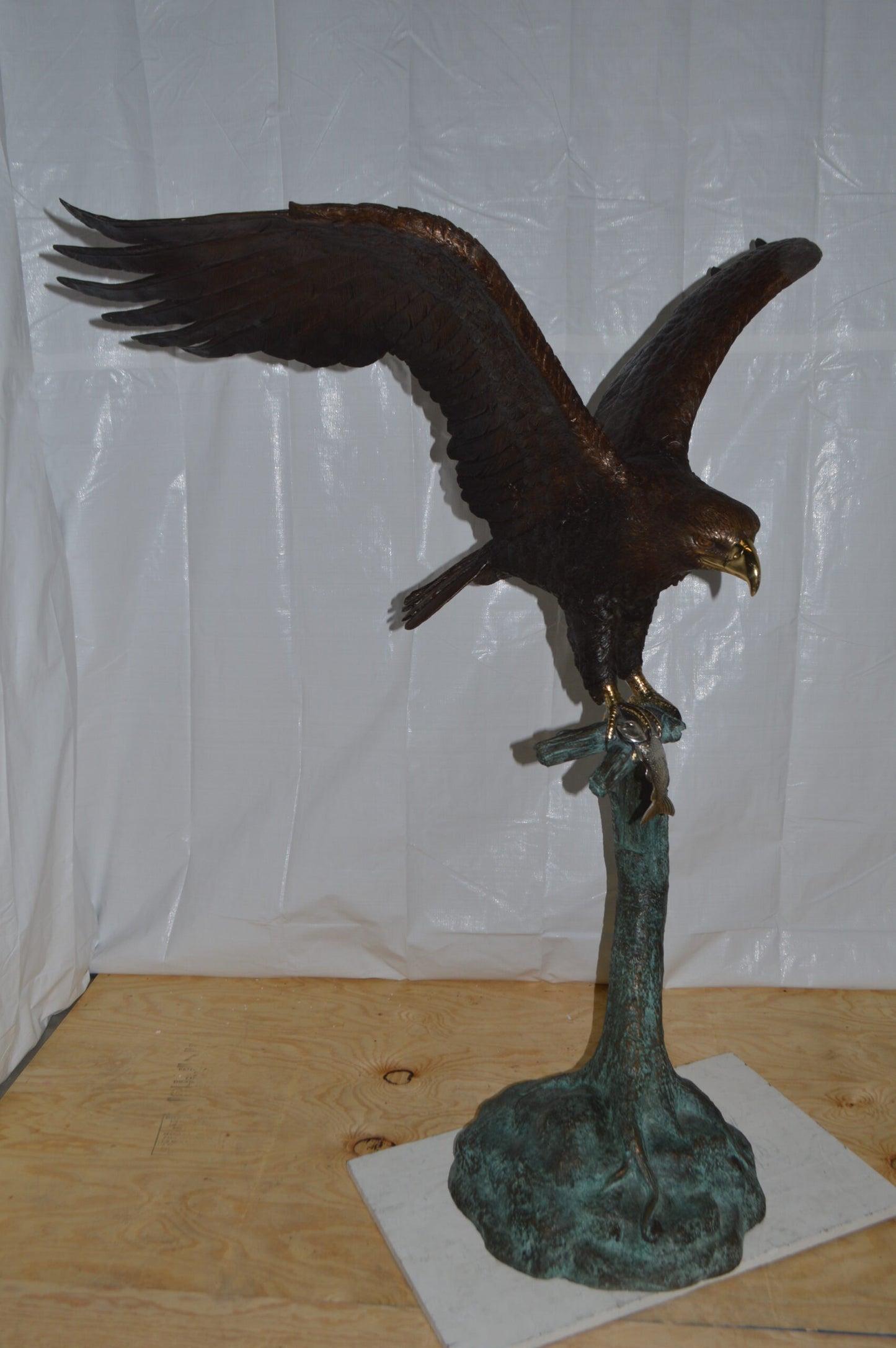 Eagle on a Tree Branch Bronze Statue - Size: 44"L x 50"W x 65"H.