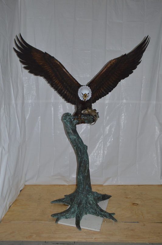 Eagle on a Tree with white face Bronze Statue - Size: 40"L x 70"W x 90"H.