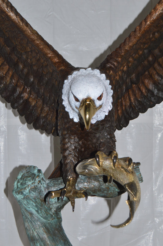 Eagle on a Tree with white face Bronze Statue -  Size: 40"L x 70"W x 90"H.